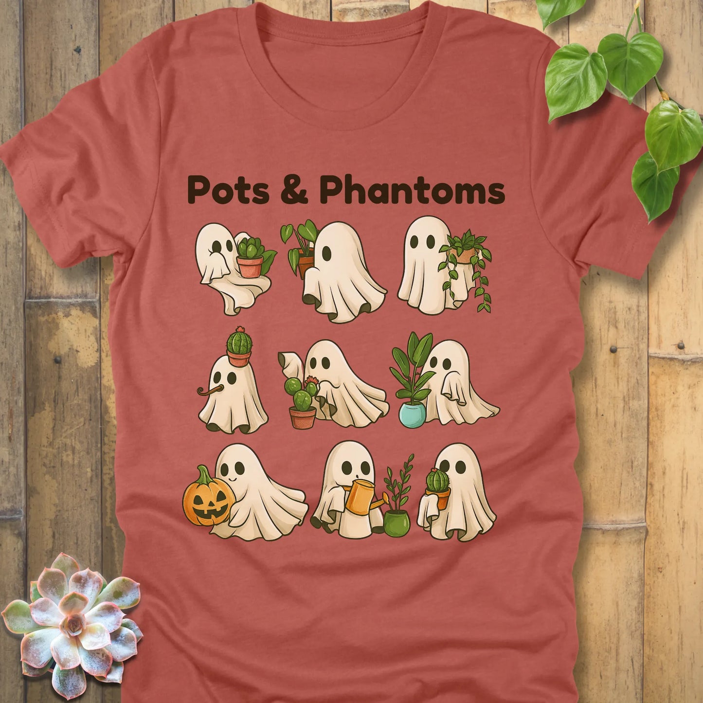 Heather Clay t-shirt featuring the design Pots & Phantoms printed in  black letters and a ghost holding a plants, pumpkin and water sprinkler