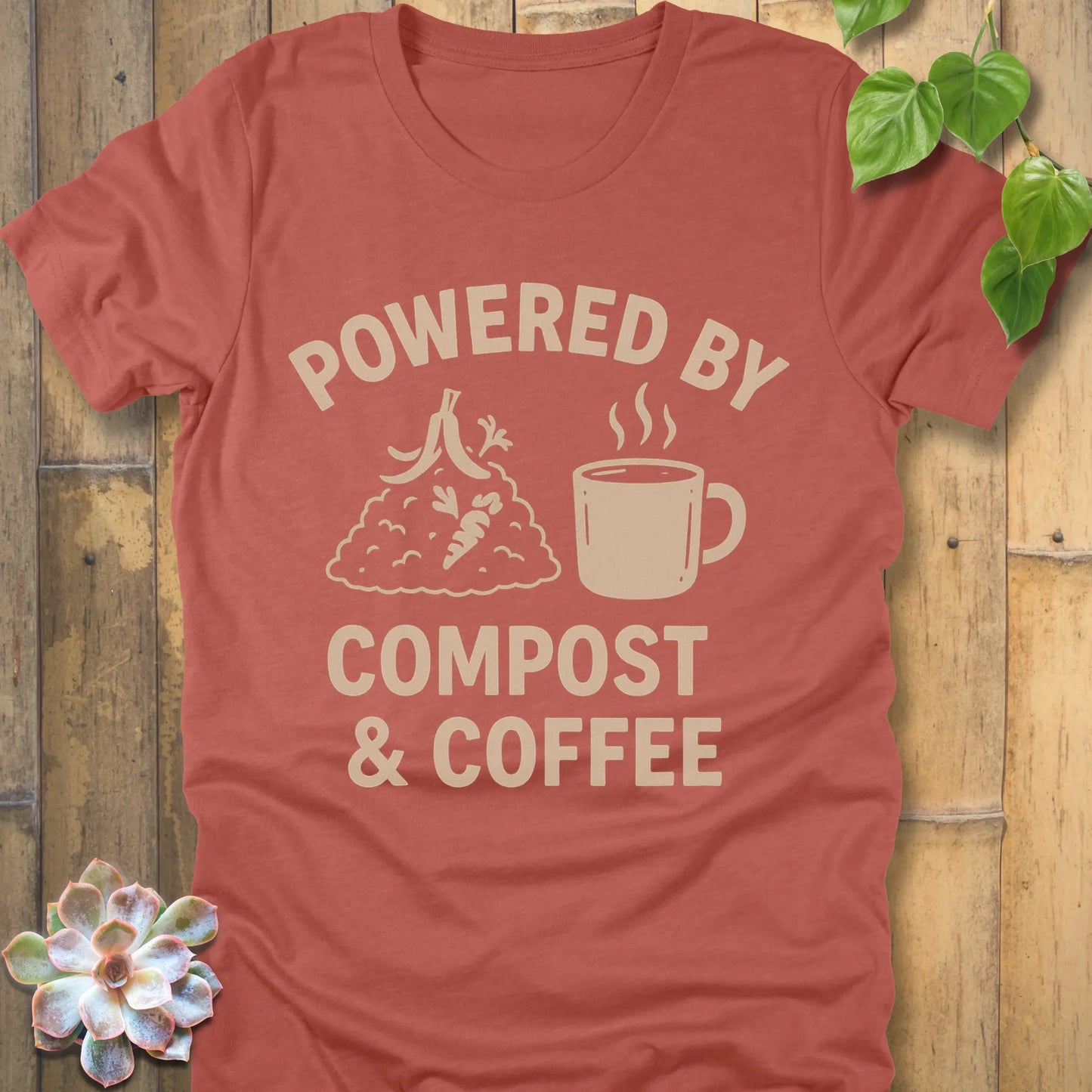 Heather Clay t-shirt featuring the design Powered By Compost & Coffee printed in bold letters with mug of coffee