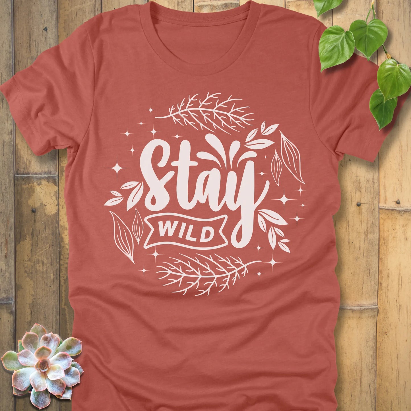 Heather Clay t-shirt featuring the design Stay Wild printed in white letters, nature lover shirt.