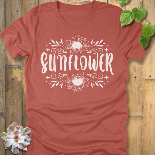 Heather Clay t-shirt featuring the design Sunflower printed in white letters and sunflower, floral graphic tee.