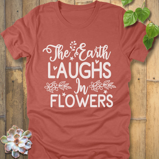 Heather Clay t-shirt featuring the design The earth laughs in flowers printed in bold white letters