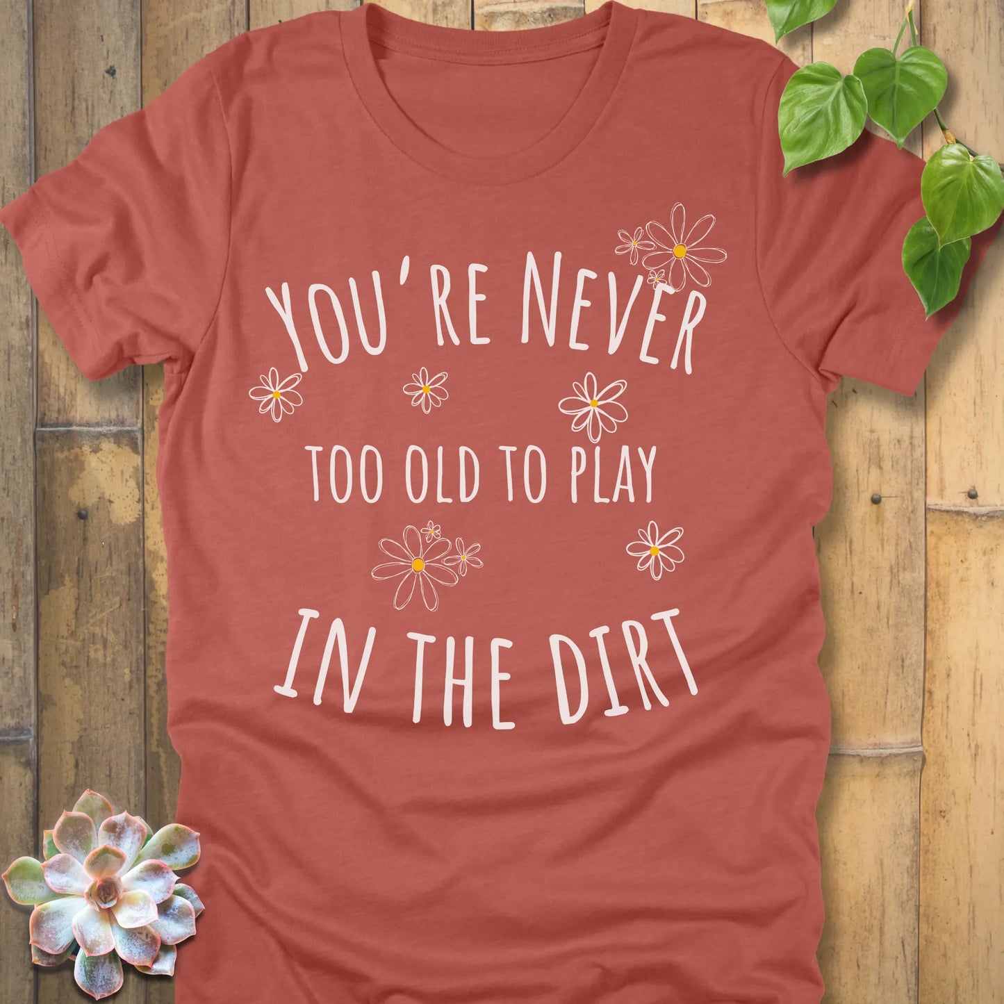 Heather Clay t-shirt featuring the design Too Old printed in bold letters, funny flowers design shirt.