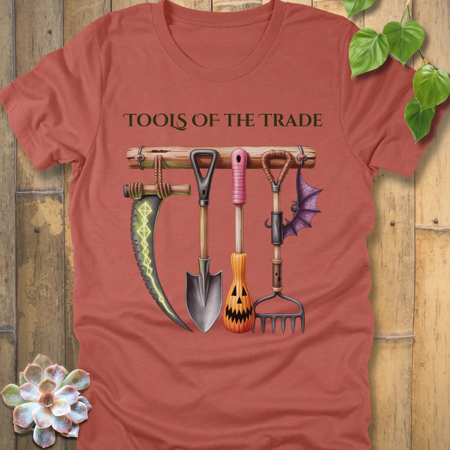 Heather Clay t-shirt featuring the design Tools of the Trade printed in bold letters with a halloween tools