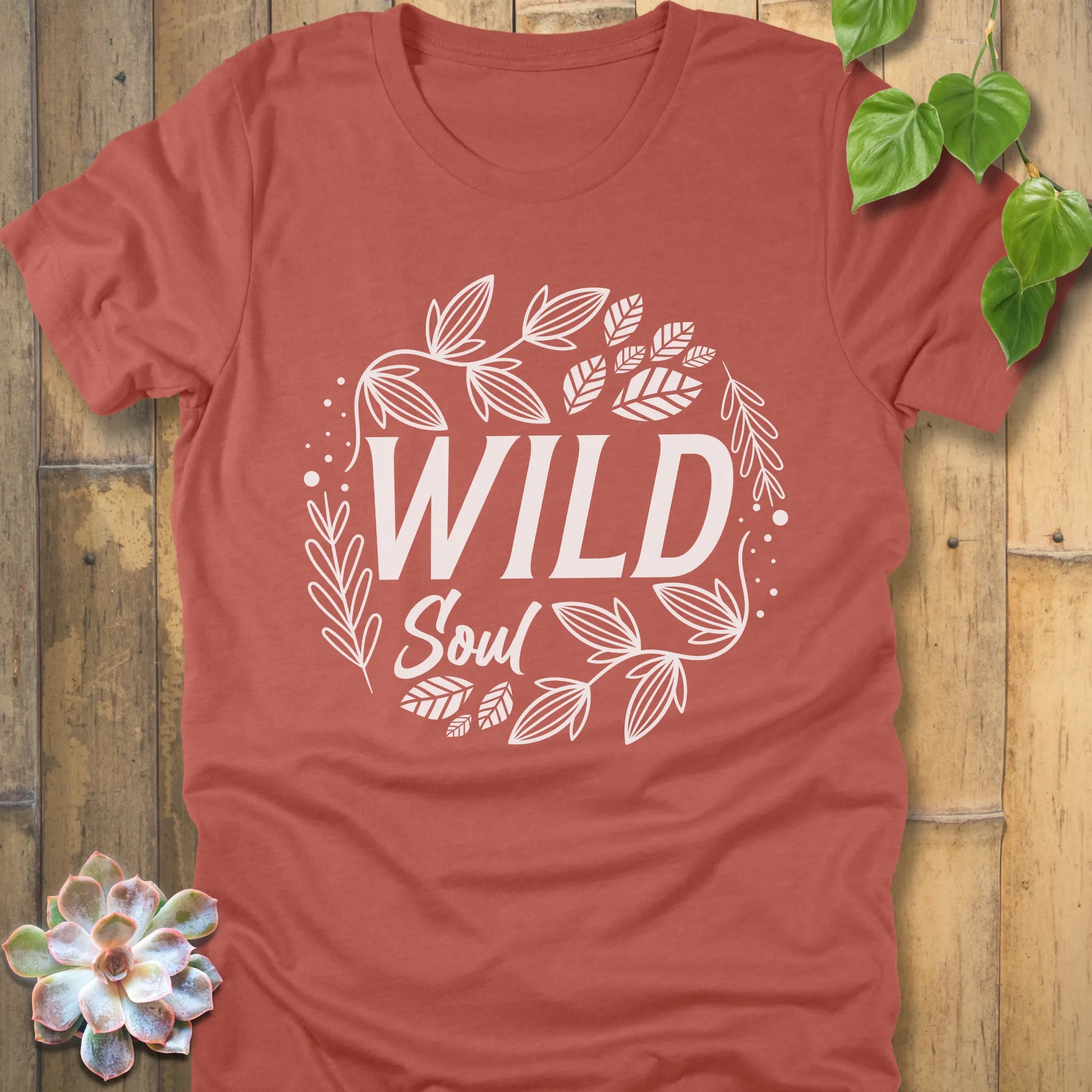Heather Clay t-shirt featuring the design Wild Soul printed in black letters with leaves