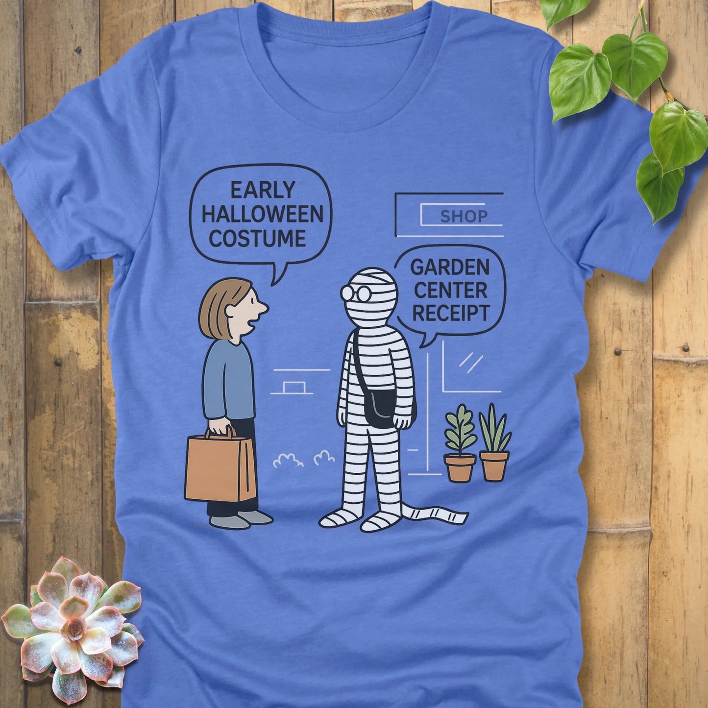 Heather Columbia Blue t-shirt featuring the design Halloween Costume printed in bold black letters, funny Halloween shirt.