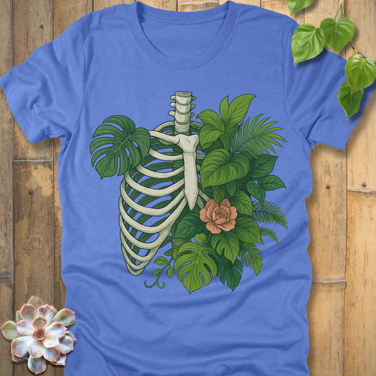 Heather Columbia Blue t-shirt featuring the design Jungle Bones printed in bones, leaves and flowers, casual jungle graphic shirt.