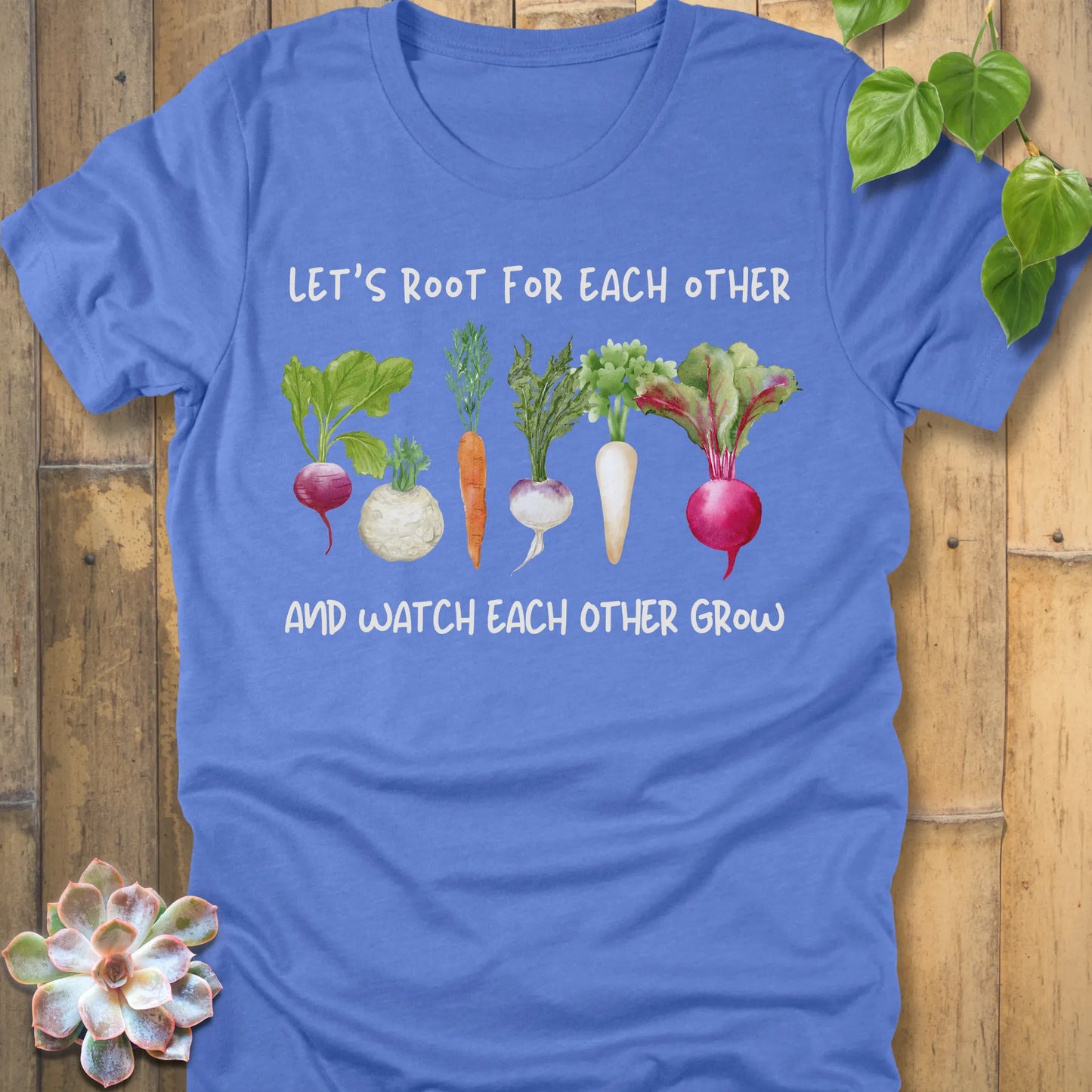 Heather Columbia Blue t-shirt featuring the design Let’s Root printed in bold letters and a vegetables, casual gardening shirt.