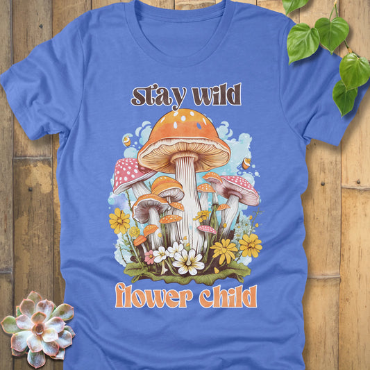 Heather Columbia Blue t-shirt featuring the design Stay Wild Flower printed in bold letters, floral graphic tee.