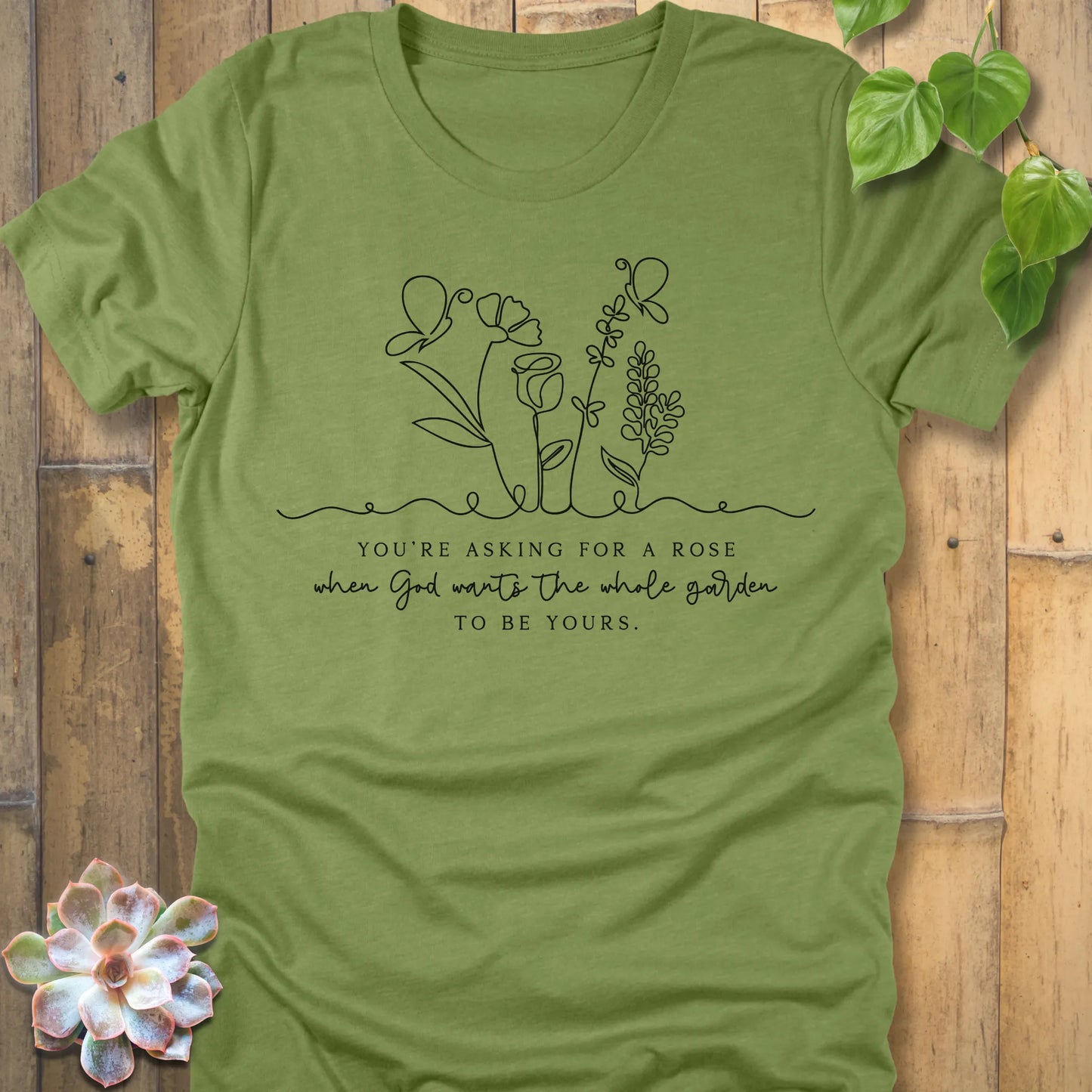 Heather Green t-shirt featuring the design Asking for a rose, printed in black letters, soft pastel cotton shirt