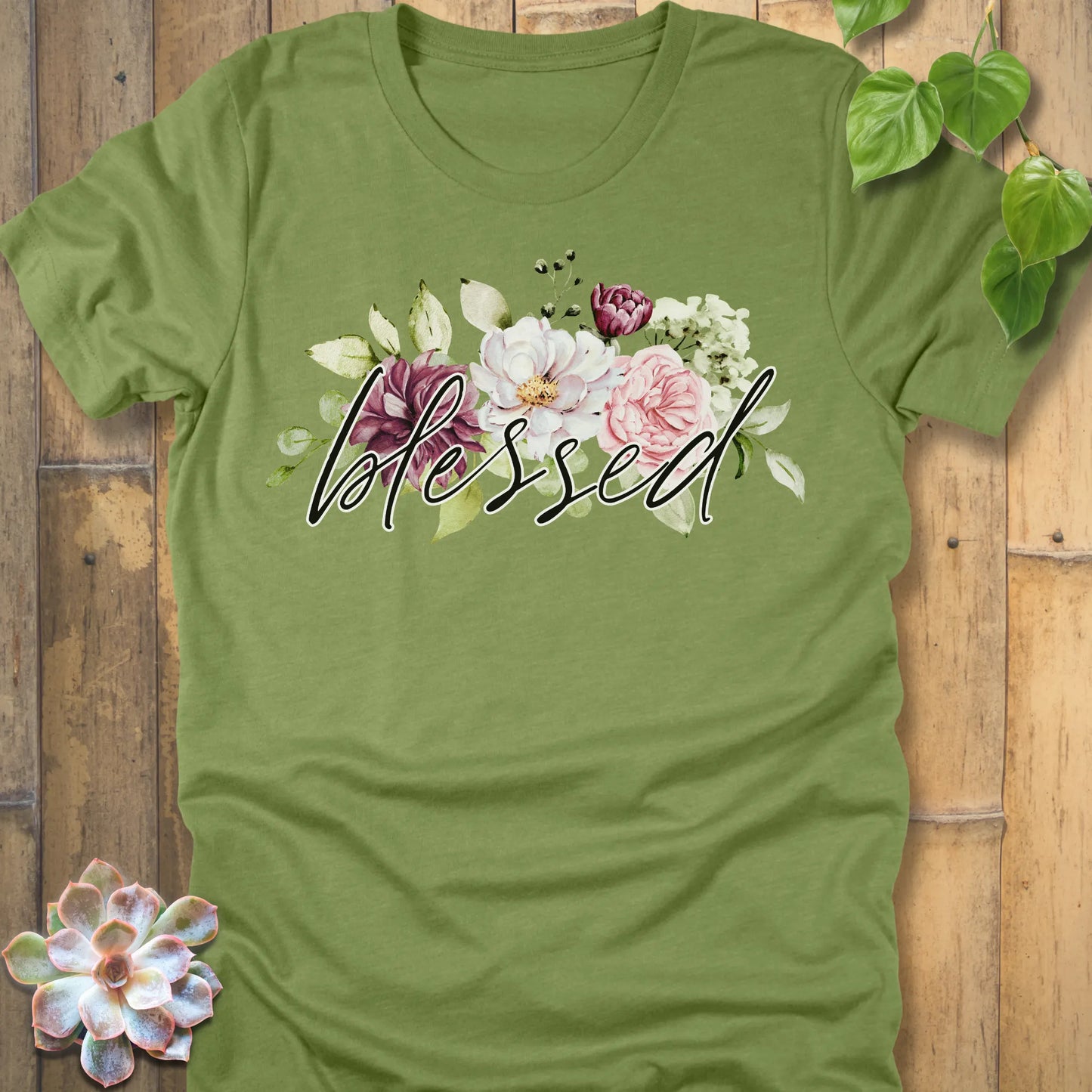Heather Green t-shirt featuring the design Blessed Flowers printed black letters and flowers, faith and floral shirt.
