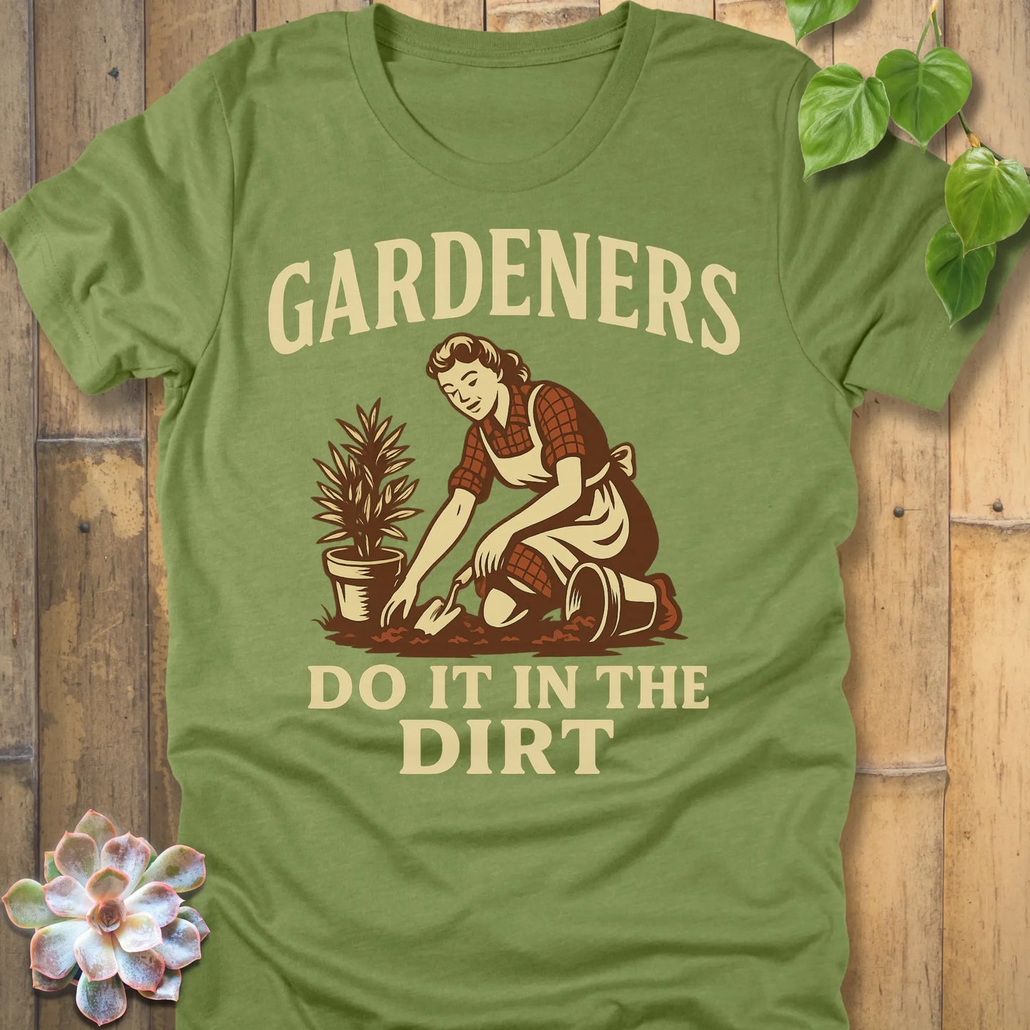 Heather Green t-shirt featuring the design Do It In The Dirt printed in bold letters, funny gardening shirt.