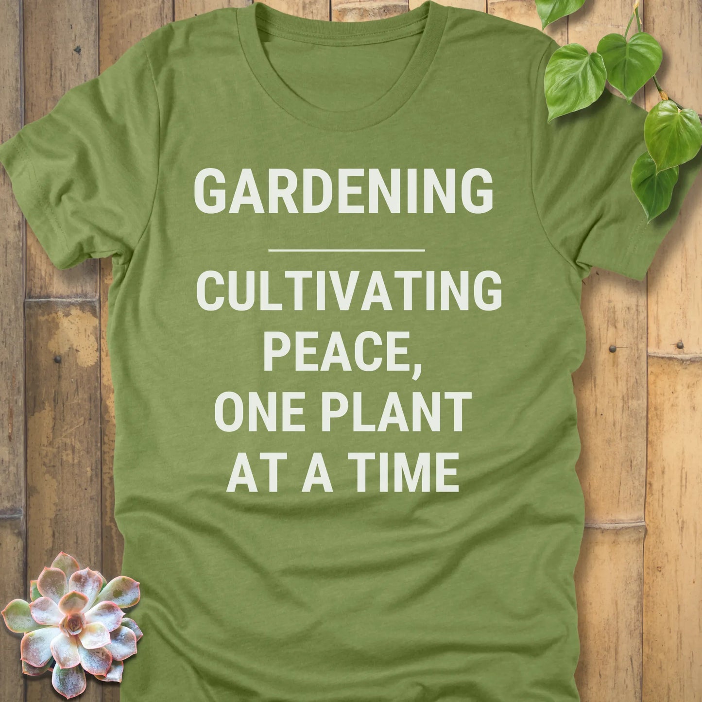 Heather Green t-shirt featuring the design Gardening Cultivating Peace, One Plant At A Time printed in bold white letters, funny gardening shirt.