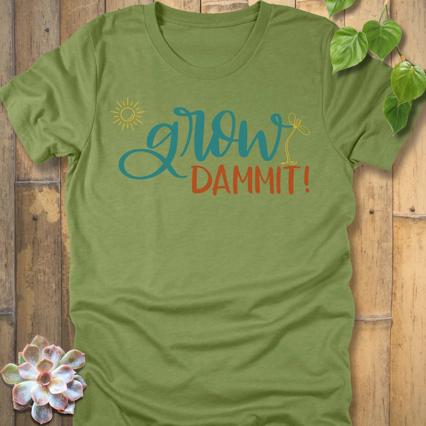 Heather Green t-shirt featuring the design Grow Dammit printed in bold letters, casual gardening shirt.