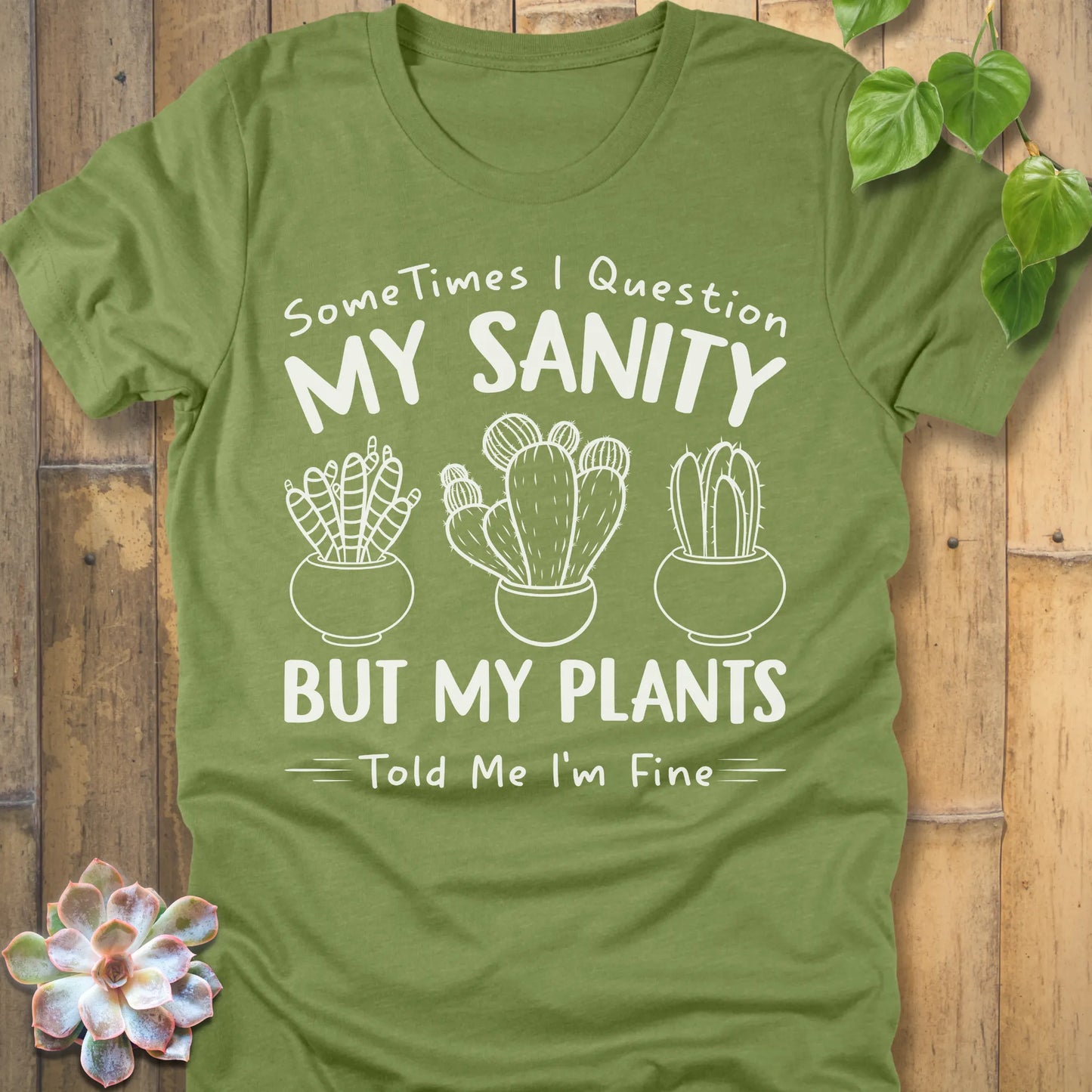 Heather Green t-shirt featuring the design I'm Fine printed in bold white letters, ang plants