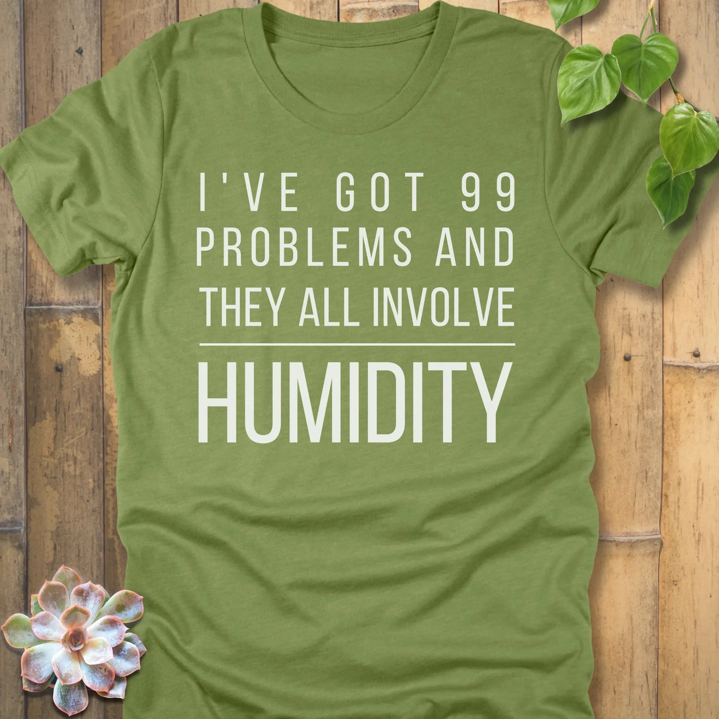 Heather Green t-shirt featuring the design I've Got 99 Problems printed in bold white letters