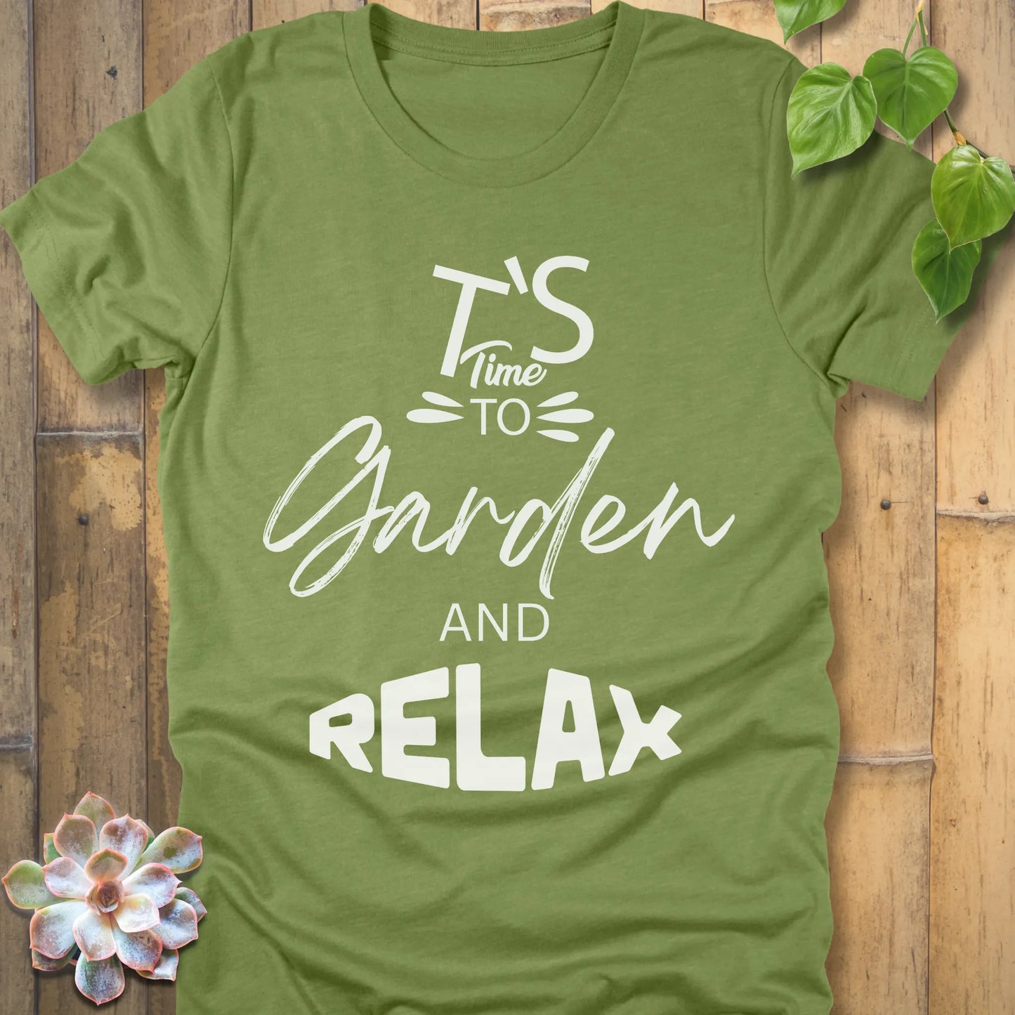 Heather Green t-shirt featuring the design "It's Time to Garden and Relax" printed in white letters