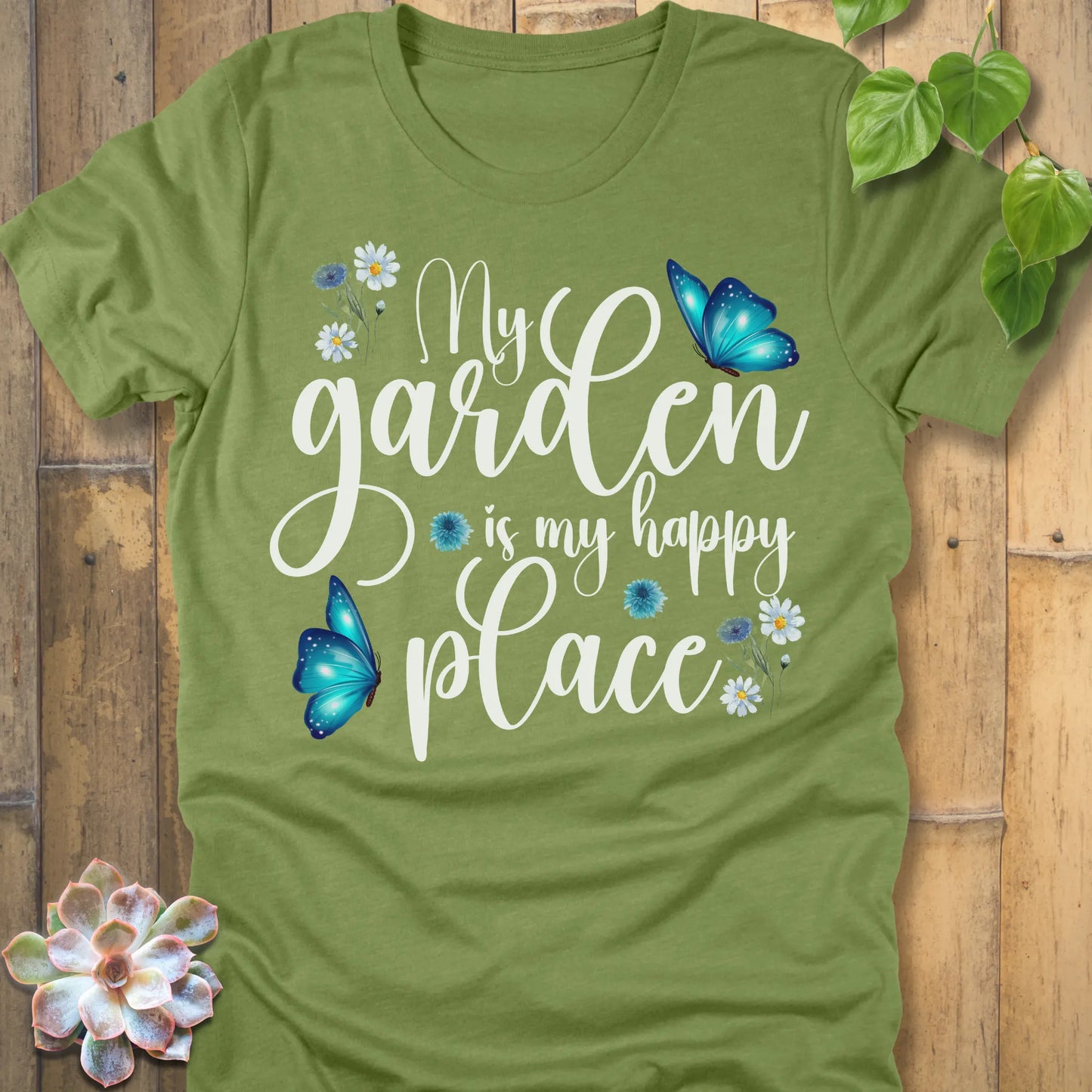 Heather Green t-shirt featuring the design My Garden Is My Happy Place with blue butterfly and flowers, funny floral gardening shirt for women.