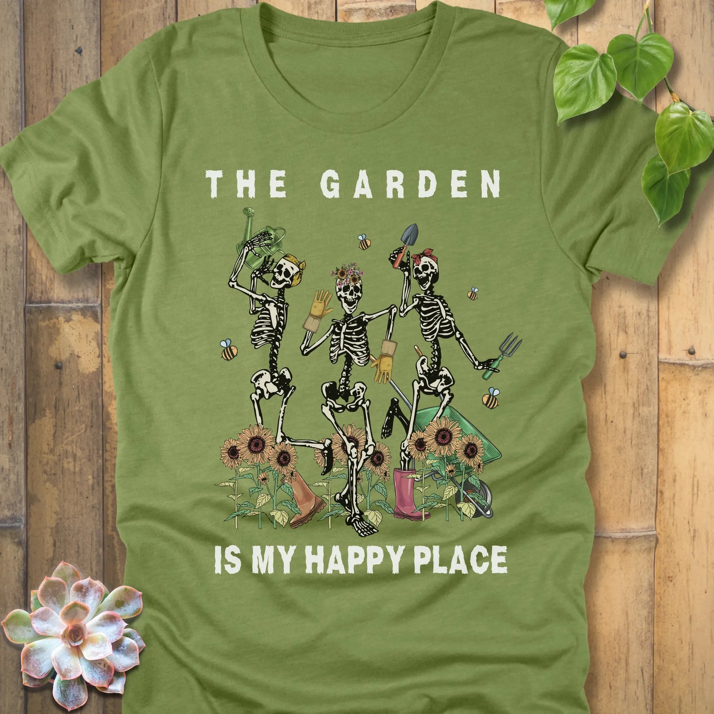 Heather Green t-shirt featuring the design "My Happy Place" printed in bold white letters and a happy skeleton 
