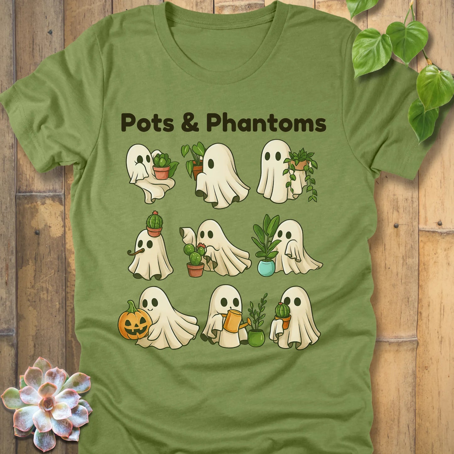 Heather Green t-shirt featuring the design Pots & Phantoms printed in  black letters and a ghost holding a plants, pumpkin and water sprinkler