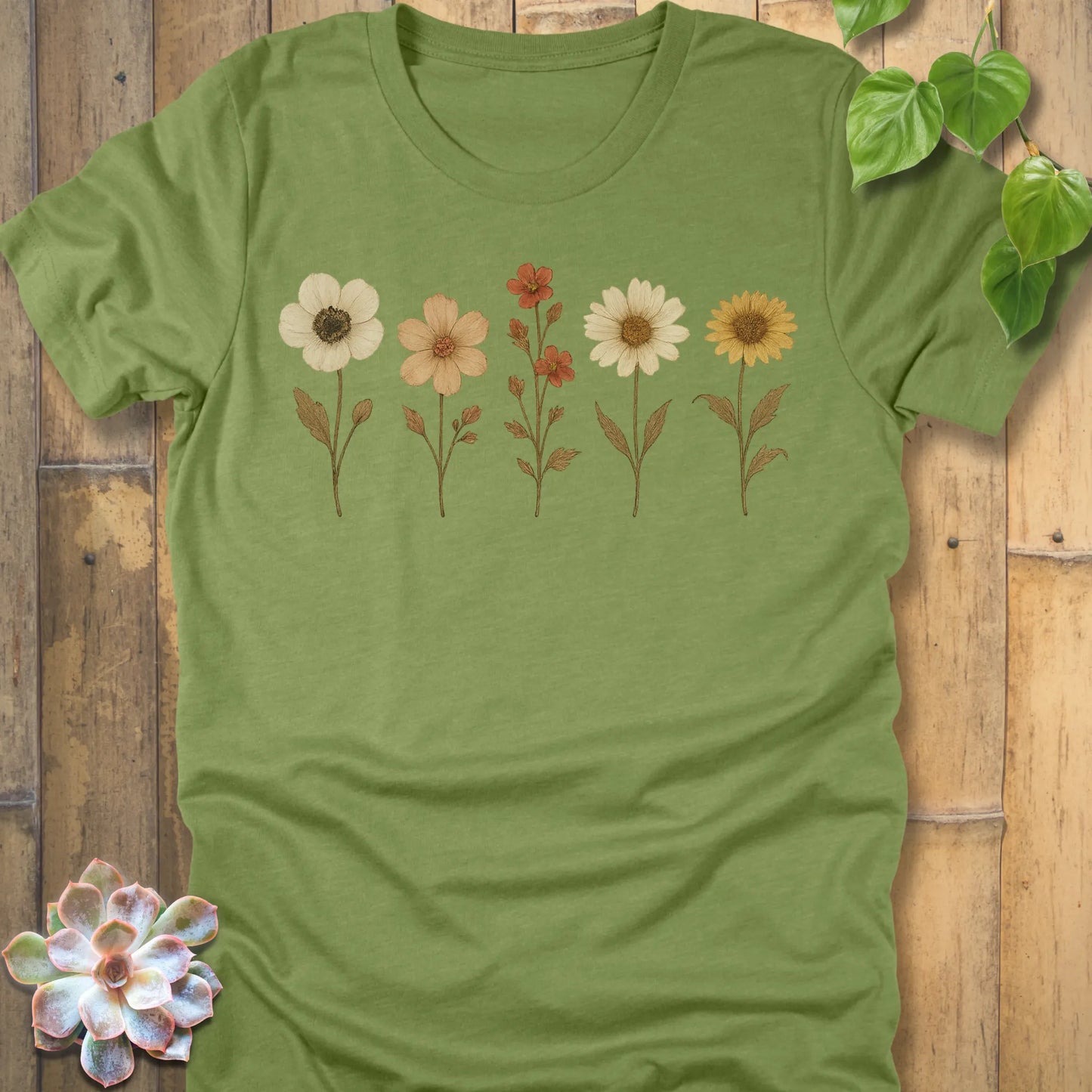 Heather Green t-shirt featuring the design Pressed Flowers printed in delicate floral pattern, botanical graphic tee.