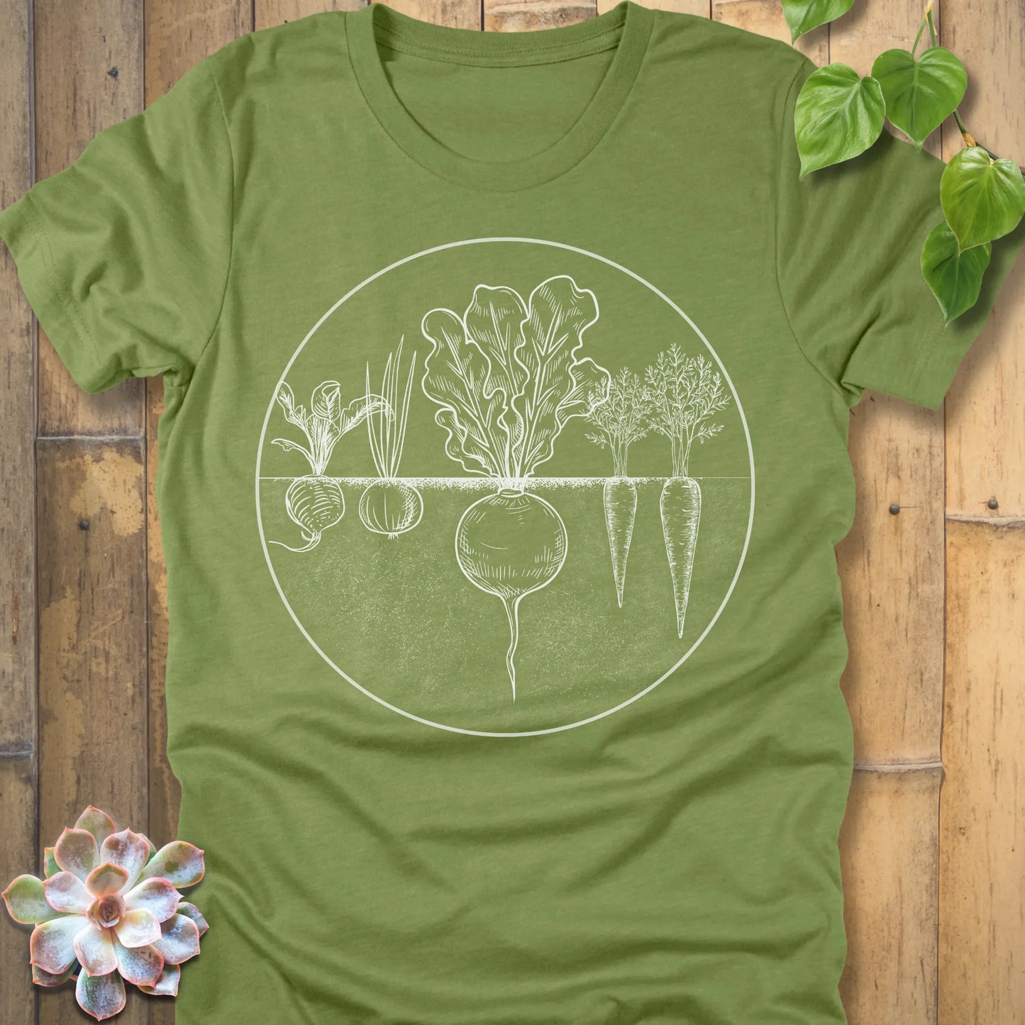 Heather Green t-shirt featuring the design Rooted Vegetables printed in white design, organic vegetable shirt.