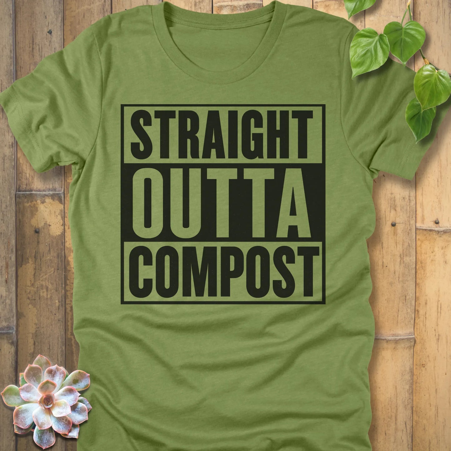 Heather Green t-shirt featuring the design Straight Outta Compost printed in bold letters, funny gardening shirt.
