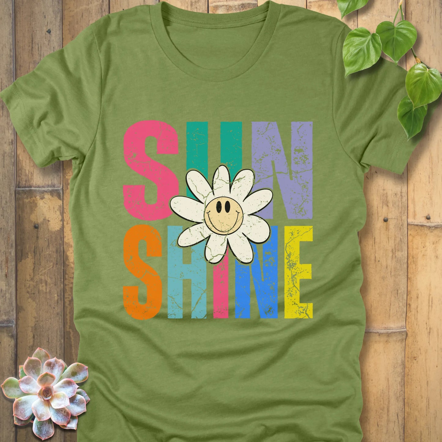 Heather Green t-shirt featuring the design Sunshine printed in colourful letters and a sunflower