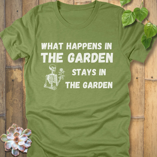 Heather Green t-shirt featuring the design What Happens In The Garden Stays In The Garden printed in bold letters with skeleton and flower