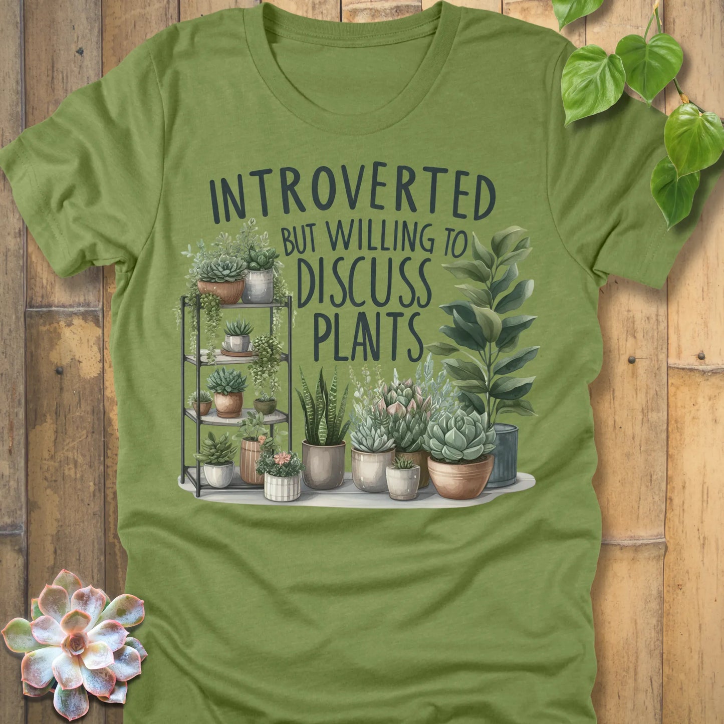 Heather Green t-shirt featuring the design Willing To Discuss Plants printed in bold black letters, funny plant lover shirt.
