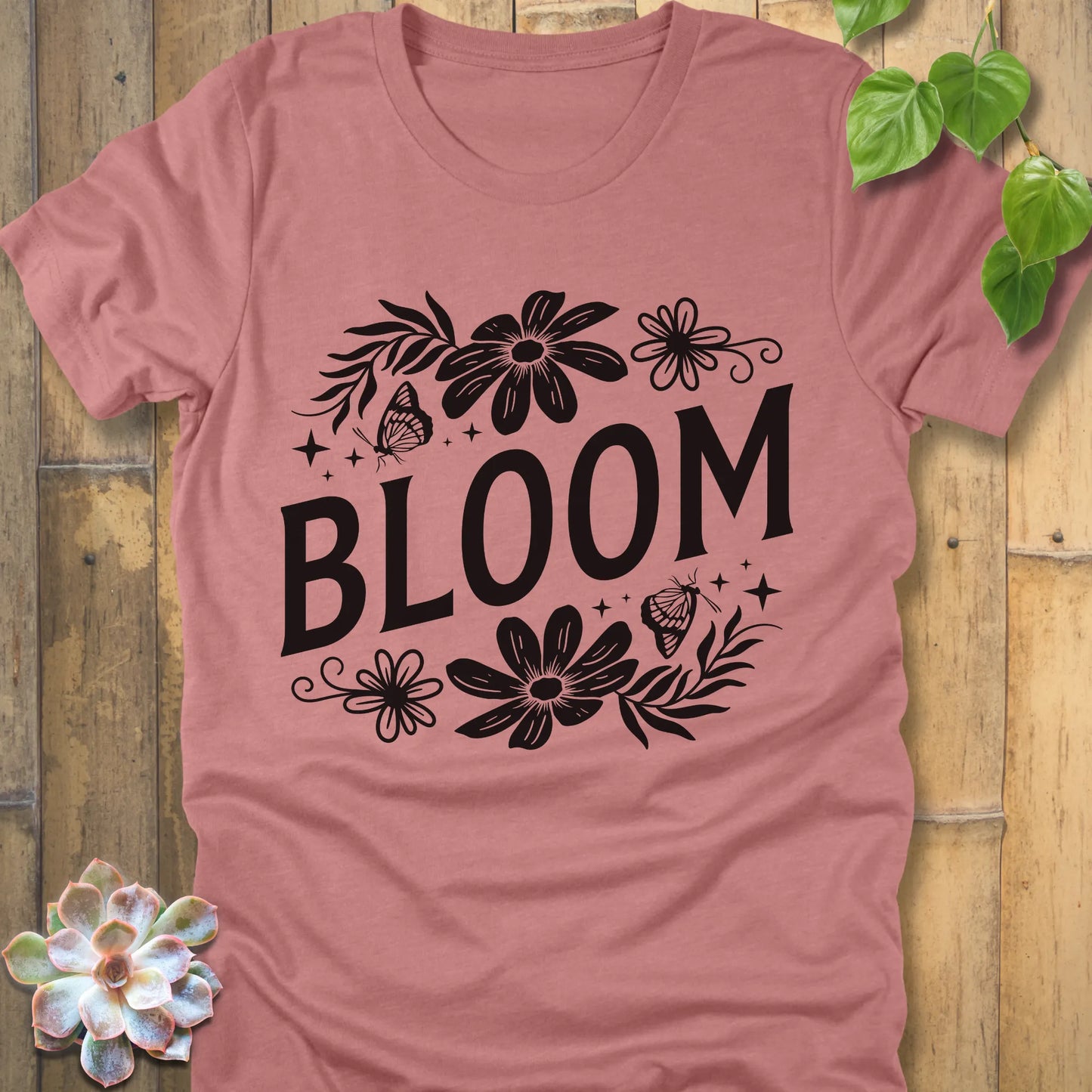 Heather Mauve t-shirt featuring the design " Bloom " printed in bold black letters with flowers