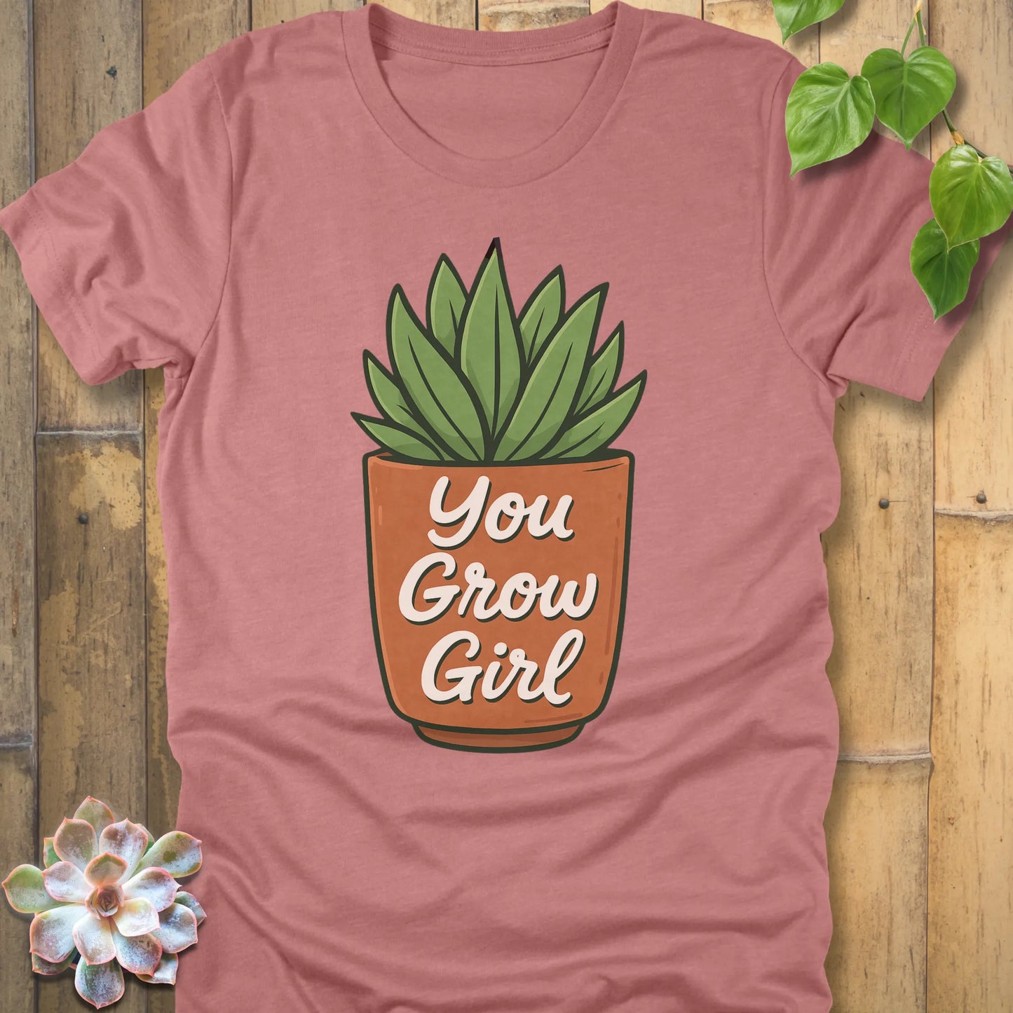 Heather Mauve t-shirt featuring the design Grow Girl printed in bold letters and plant in the pot, casual plant lover shirt.