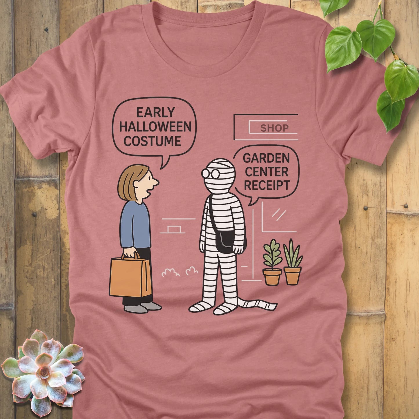 Heather Mauve t-shirt featuring the design Halloween Costume printed in bold black letters, funny Halloween shirt.