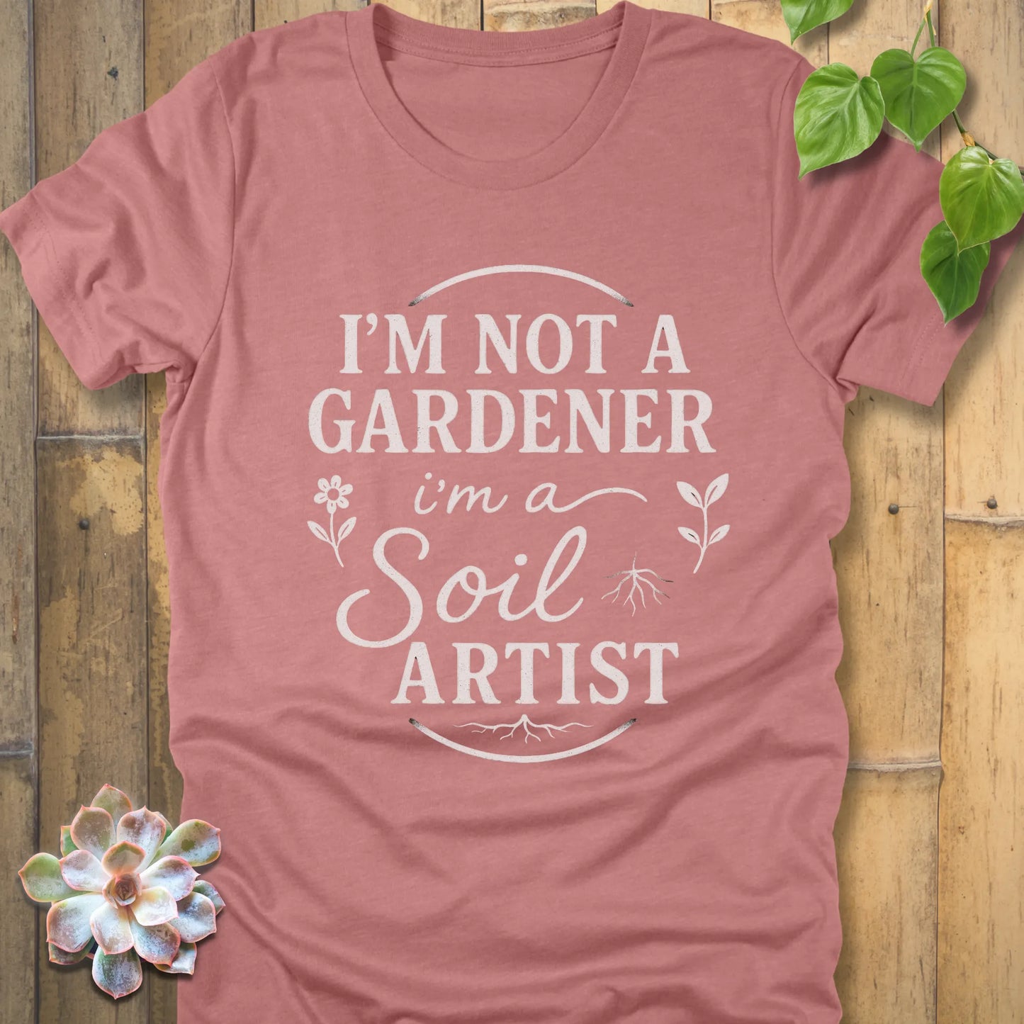 Heather Mauve t-shirt featuring the design I'm Not a Gardener I'm a Soil Artist printed in bold white letters