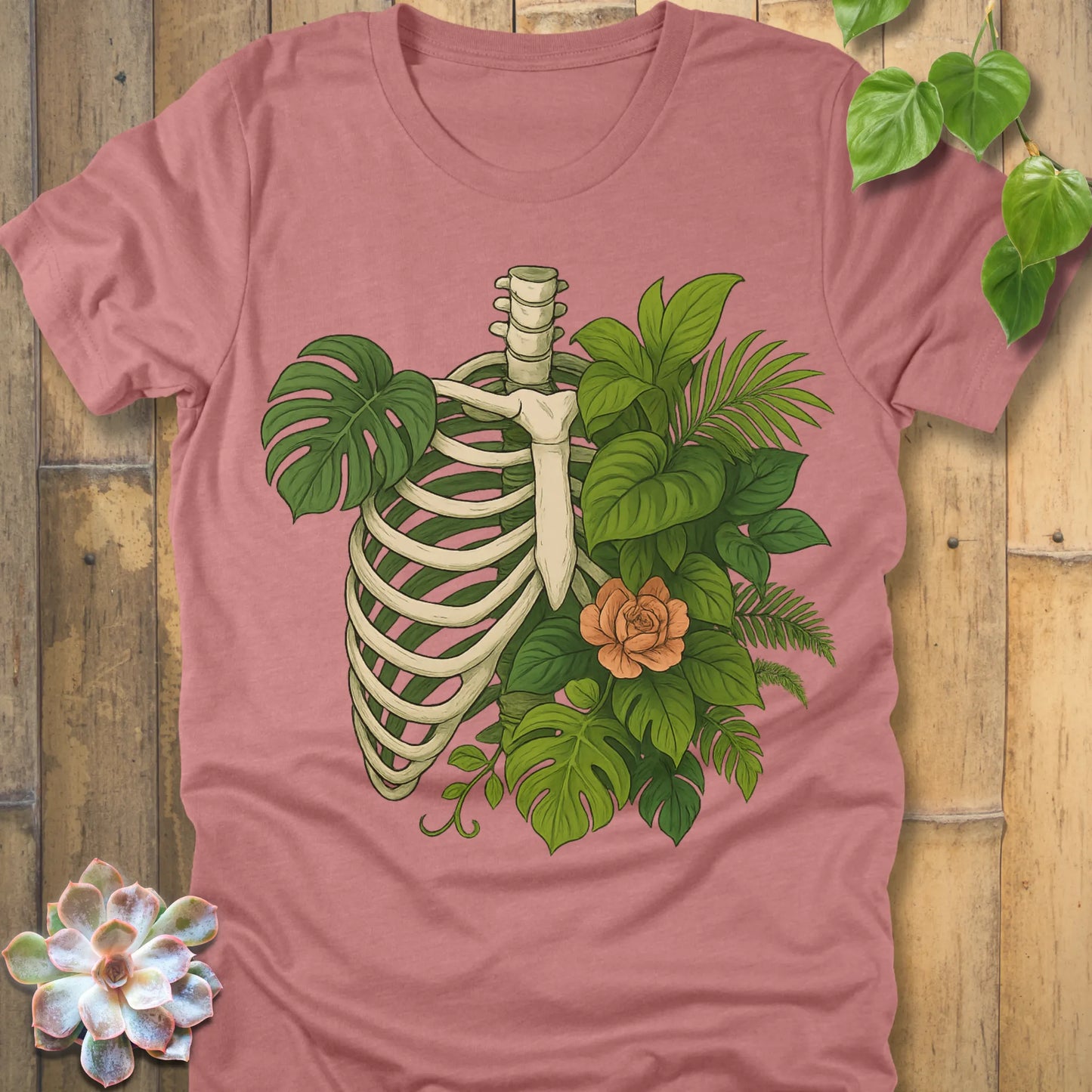 Heather Mauve t-shirt featuring the design Jungle Bones printed in bones, leaves and flowers, casual jungle graphic shirt.