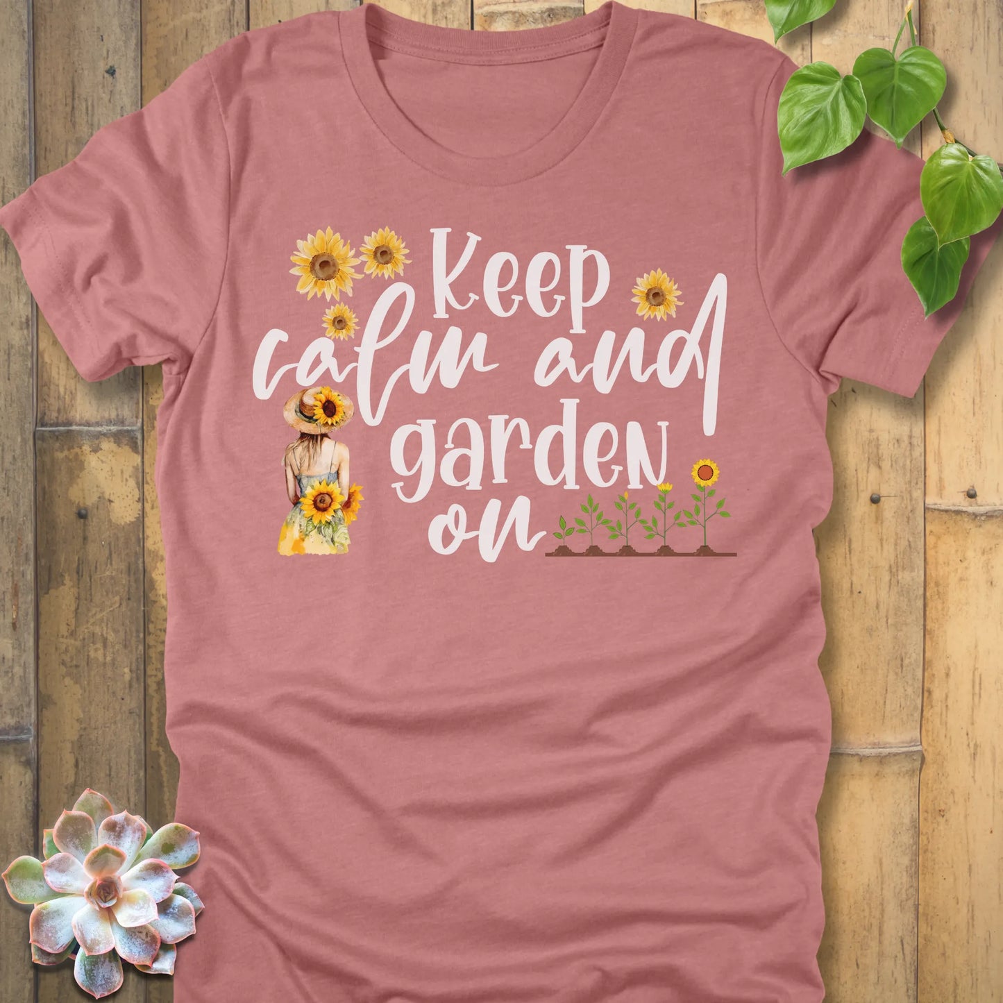 Heather Mauve t-shirt featuring the design Keep Calm printed in white letters and sunflowers