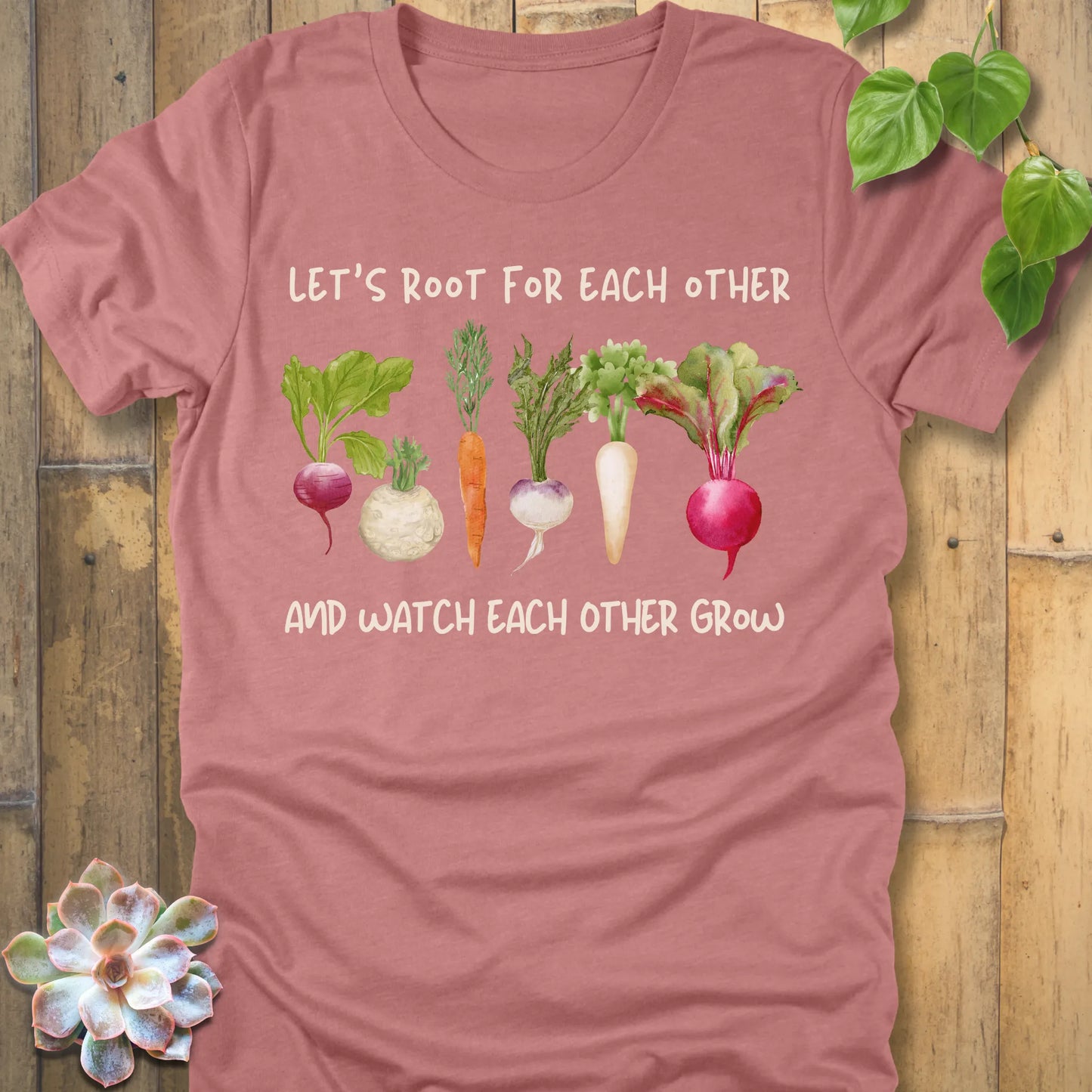 Heather Mauve t-shirt featuring the design Let’s Root printed in bold letters and a vegetables, casual gardening shirt.