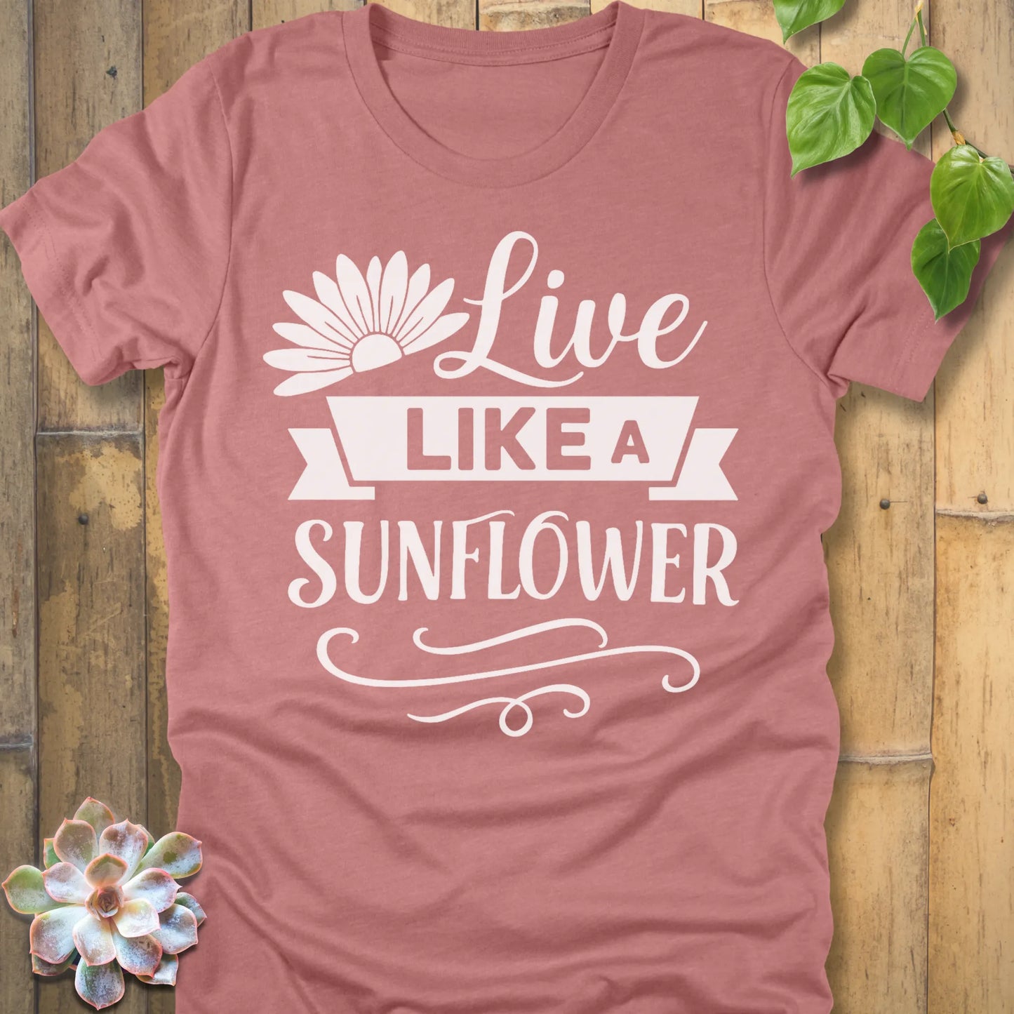 Heather Mauve t-shirt featuring the design Live Like A Sunflower printed in bold letters, motivational gardening shirt.