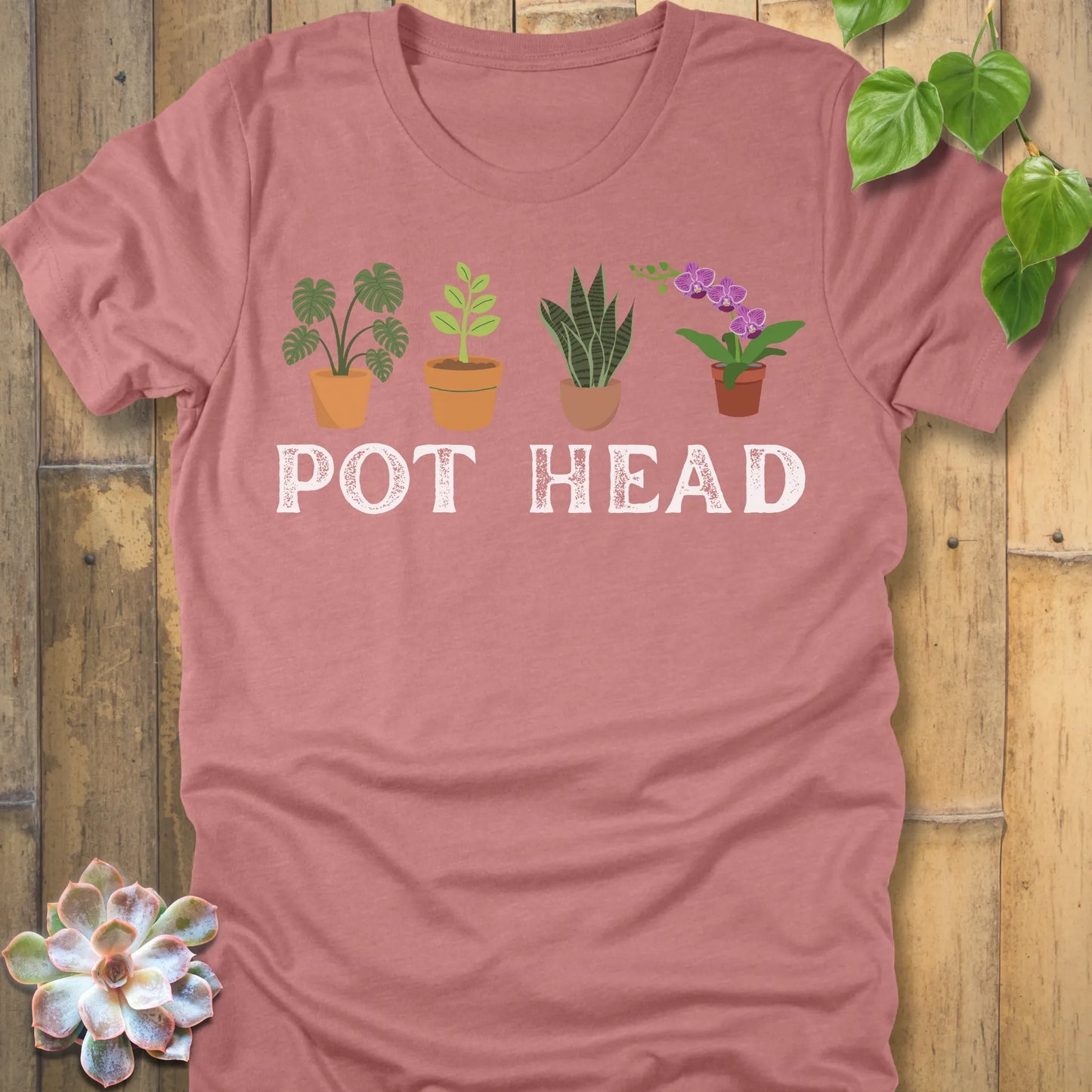Heather Mauve t-shirt featuring the design Pot Head printed in bold letters and plants in the pots, funny gardening shirt.