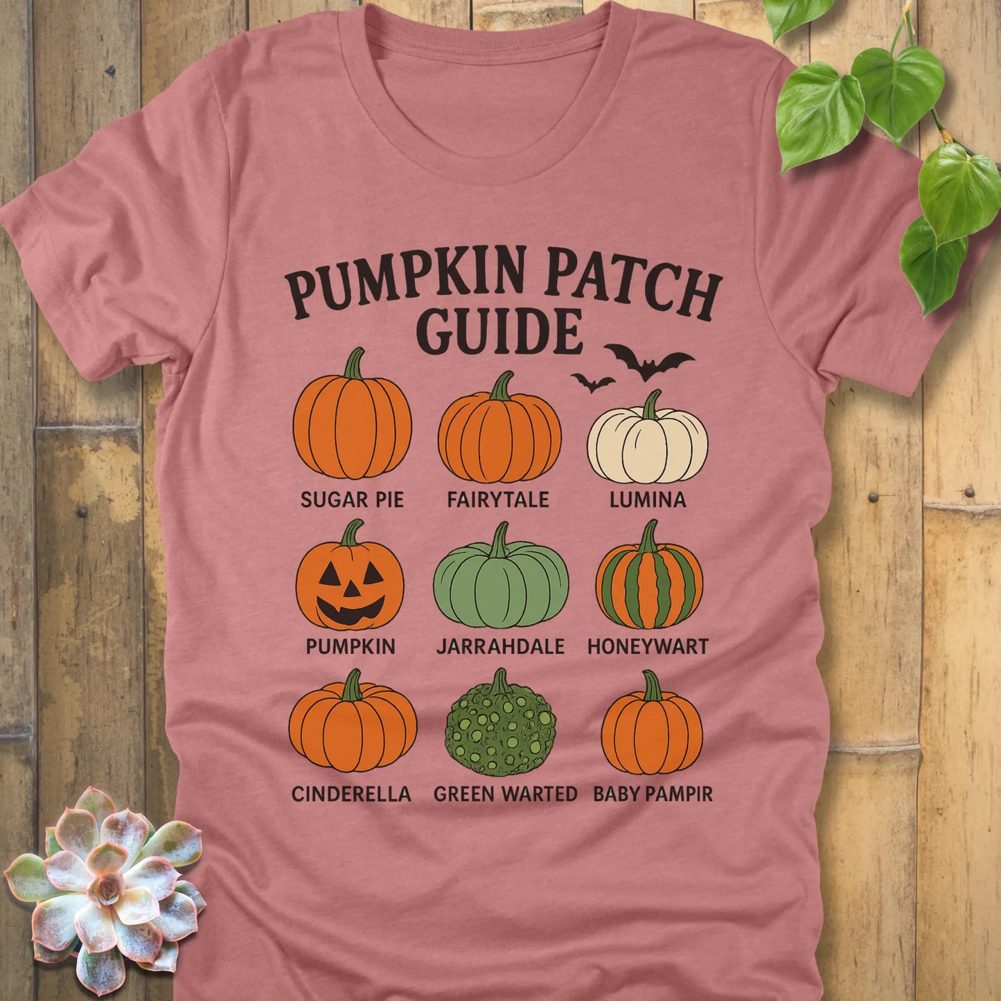 Heather Mauve t-shirt featuring the design Pumpkin Patch Guide printed in bold black letters and pumpkin