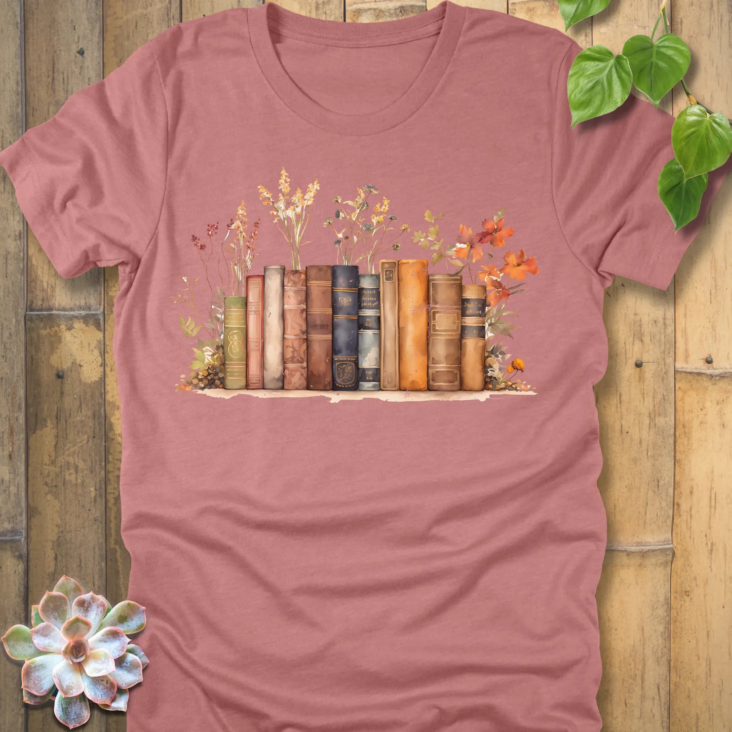 Heather Mauve t-shirt featuring the design Wildflower Library printed with books and plants, floral graphic tee for plant lovers.