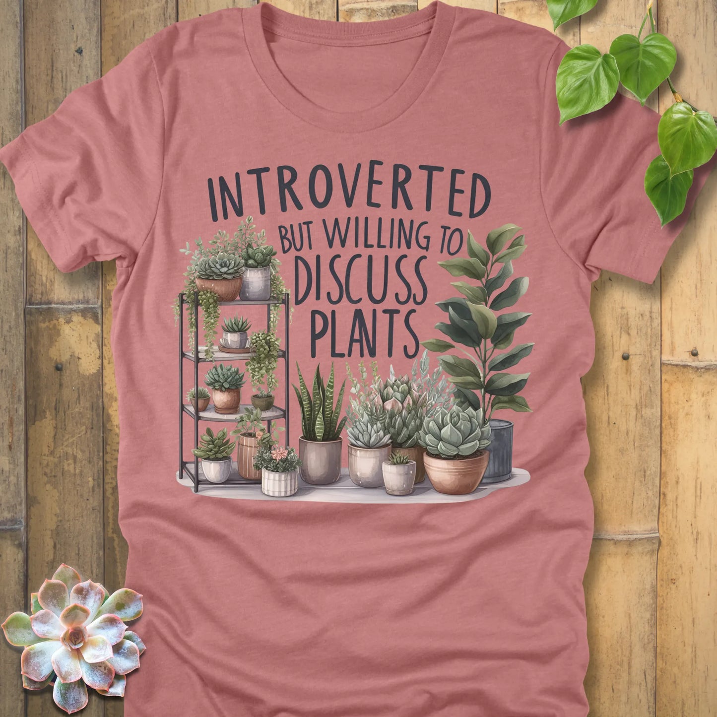 Heather Mauve t-shirt featuring the design Willing To Discuss Plants printed in bold black letters, funny plant lover shirt.