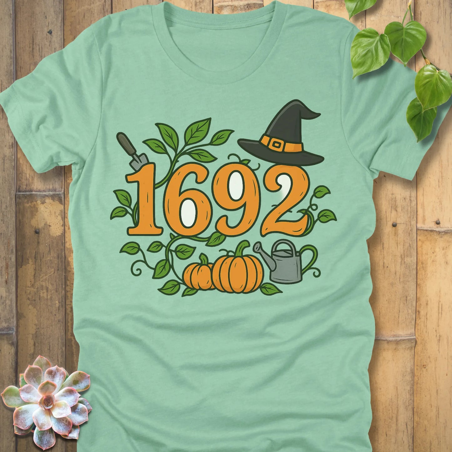 Heather Mint t-shirt featuring the design 1692 Halloween printed in spooky witch design shirt.