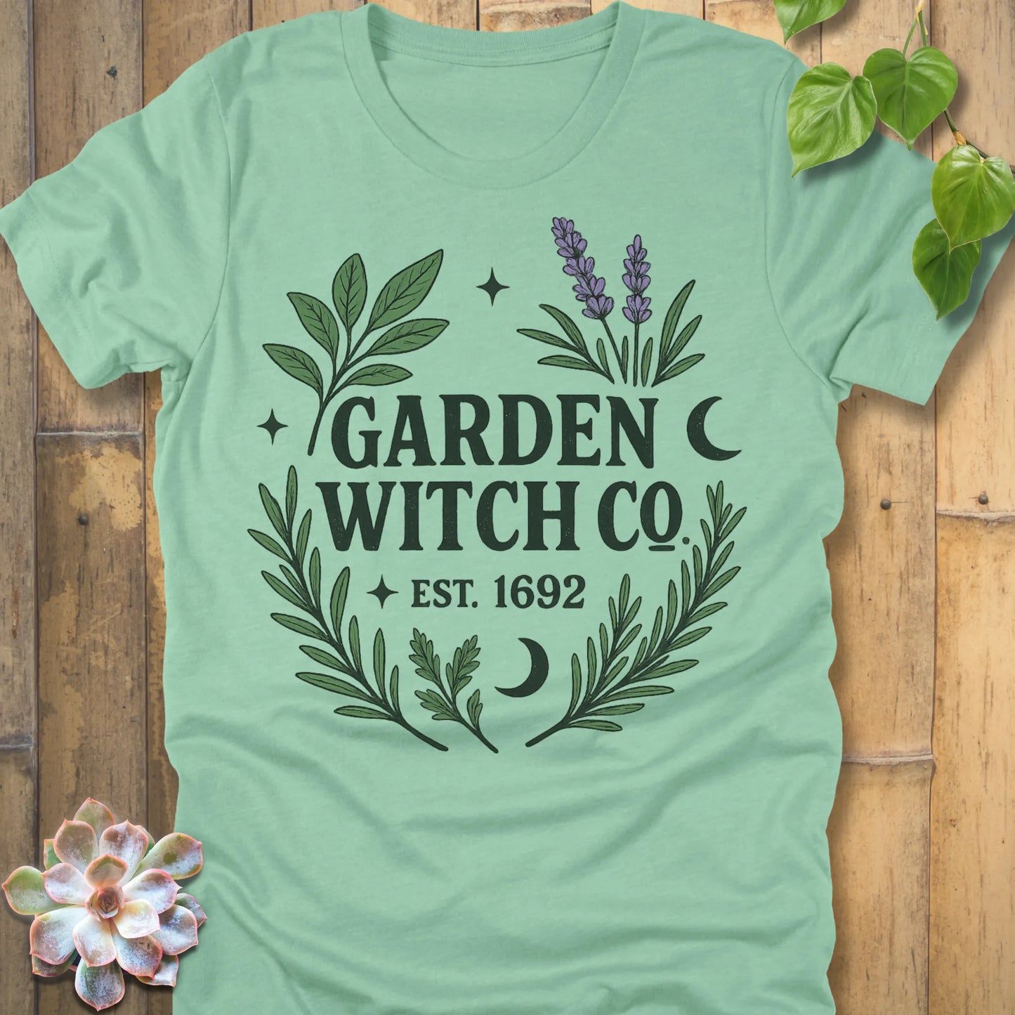 Heather Mint t-shirt featuring the design Garden Witch printed in witchy garden shirt.