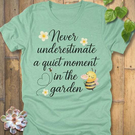 Heather Mint t-shirt featuring the design Never Underestimate printed in black letters, empowering quote shirt.