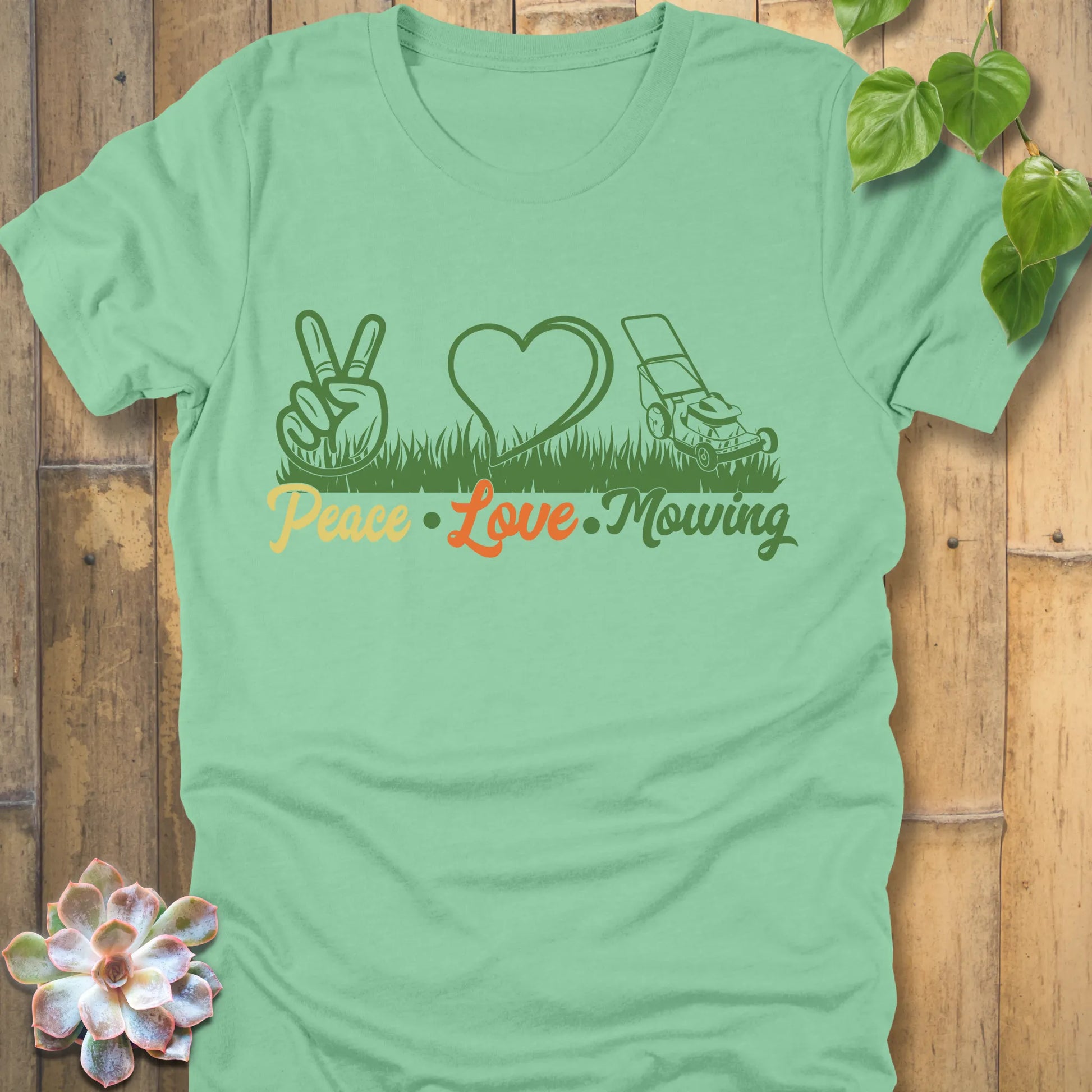 Heather Mint t-shirt featuring the design Peace, Love, Mowing with peace sign, heart and mower