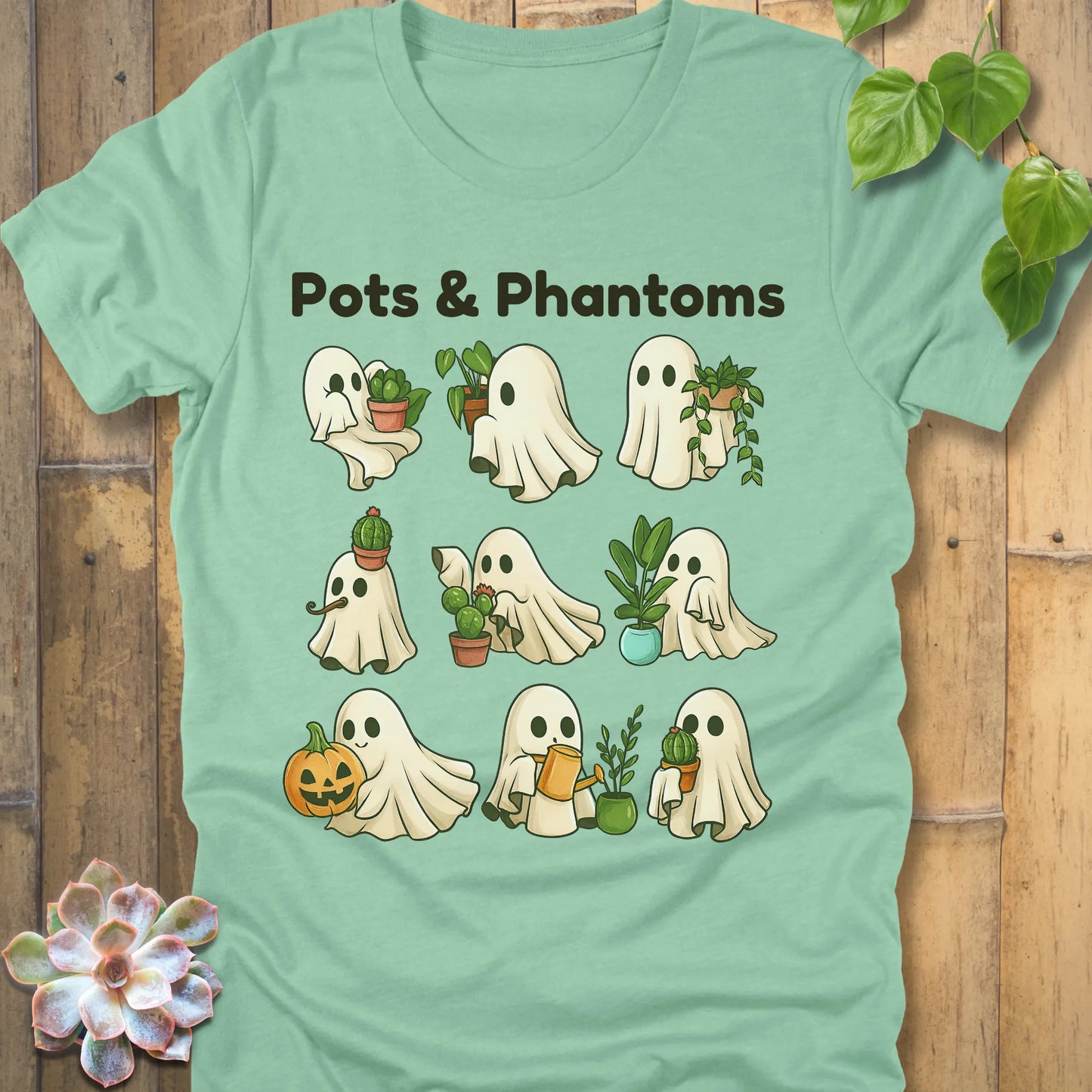 Heather Mint t-shirt featuring the design Pots & Phantoms printed in  black letters and a ghost holding a plants, pumpkin and water sprinkler