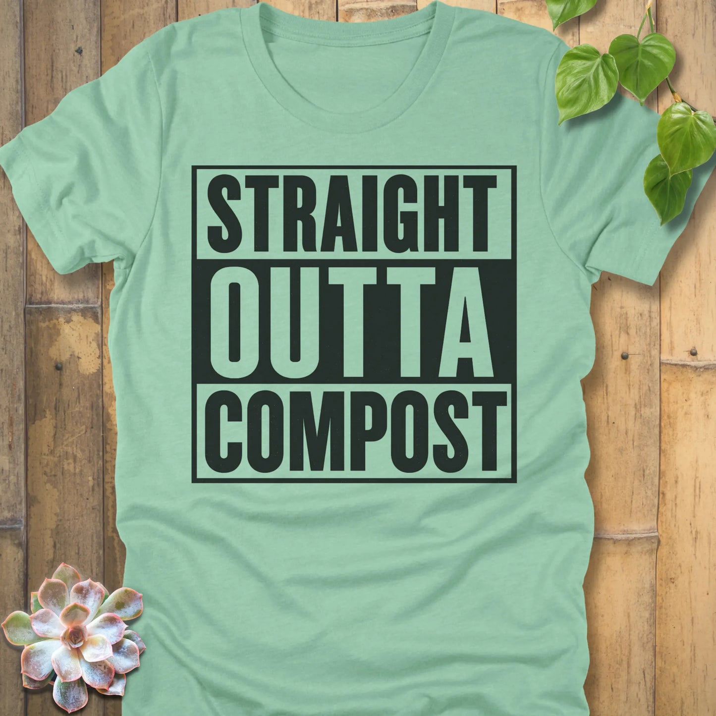 Heather Mint t-shirt featuring the design Straight Outta Compost printed in bold letters, funny gardening shirt.