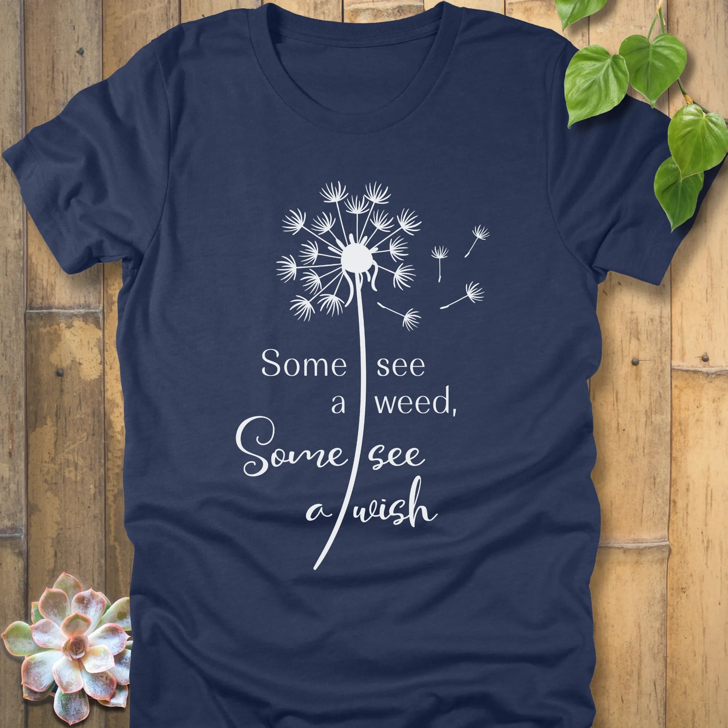 Heather Navy t-shirt featuring the dandelion design with the quote "Some see a weed, Some see a wish".
