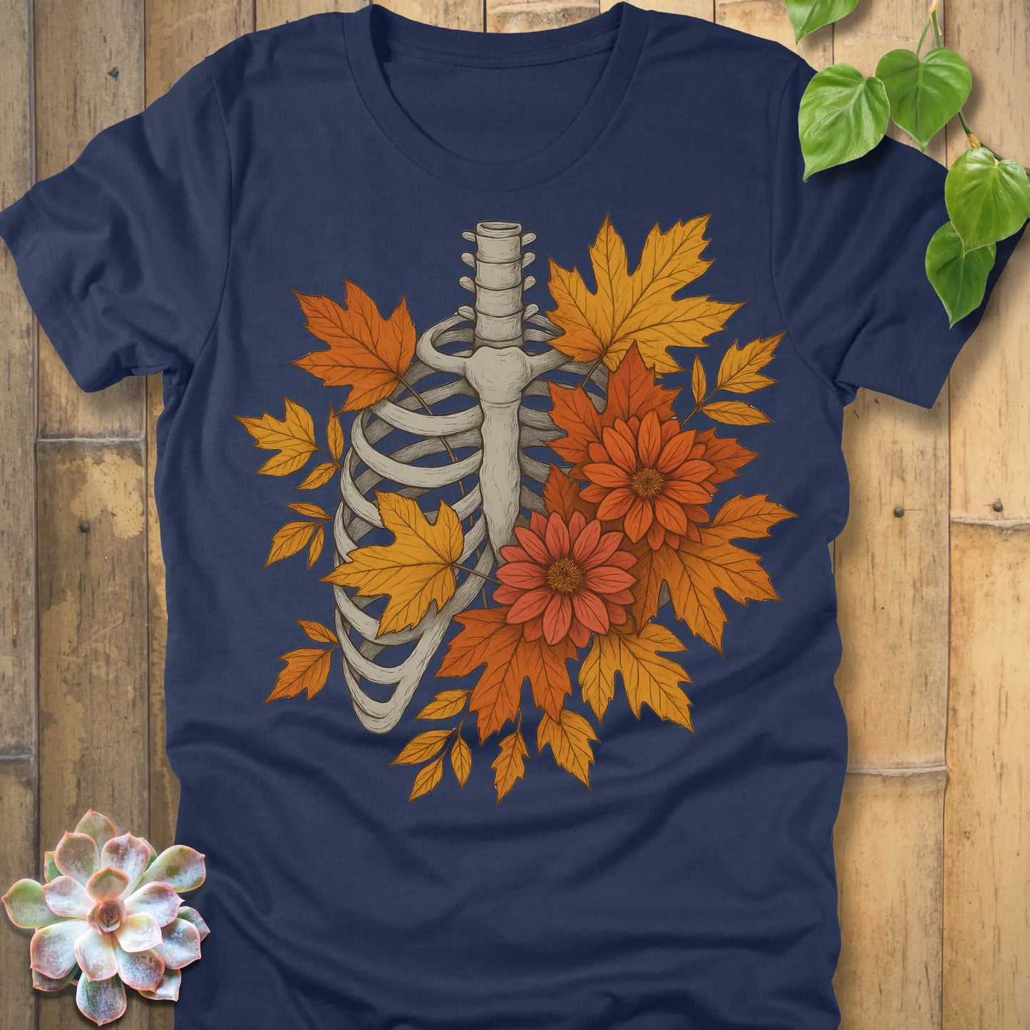 Heather Navy t-shirt featuring the design Autumn Bones printed Halloween skeleton shirt with flowers and leaves.