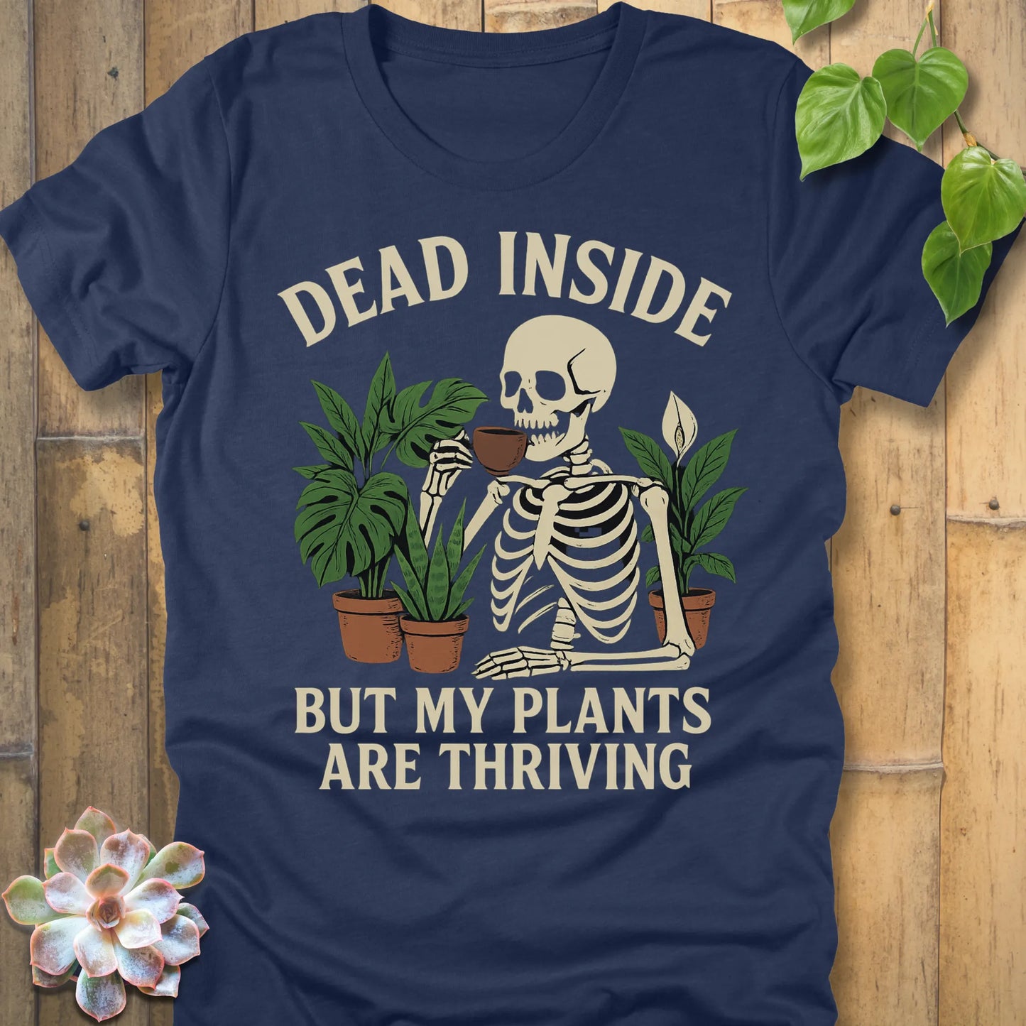 Heather Navy t-shirt featuring the design Dead Inside printed in bold letters and plants, skeleton, funny graphic tee.